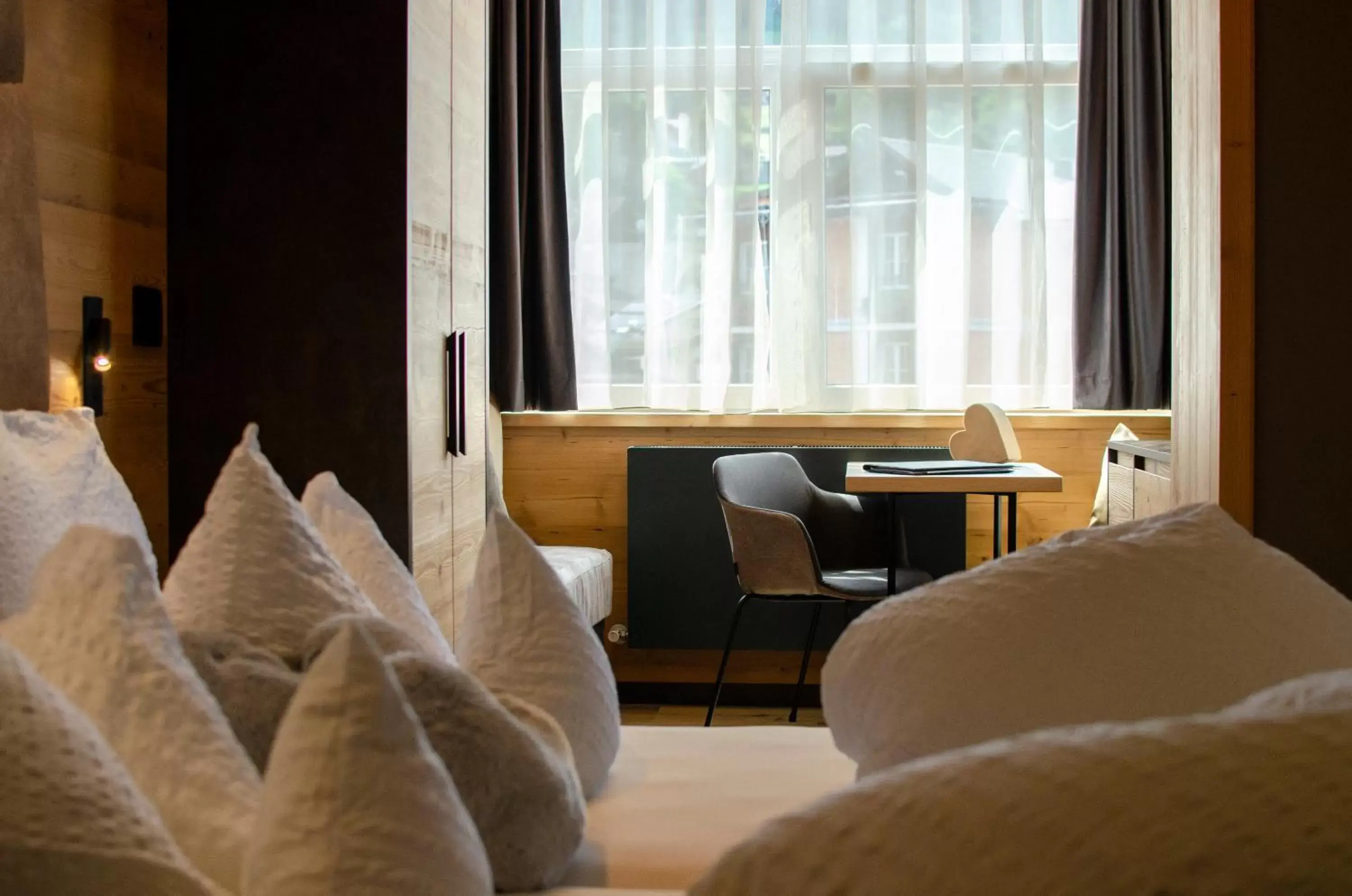 Bedroom, Seating Area in Hotel Faloria