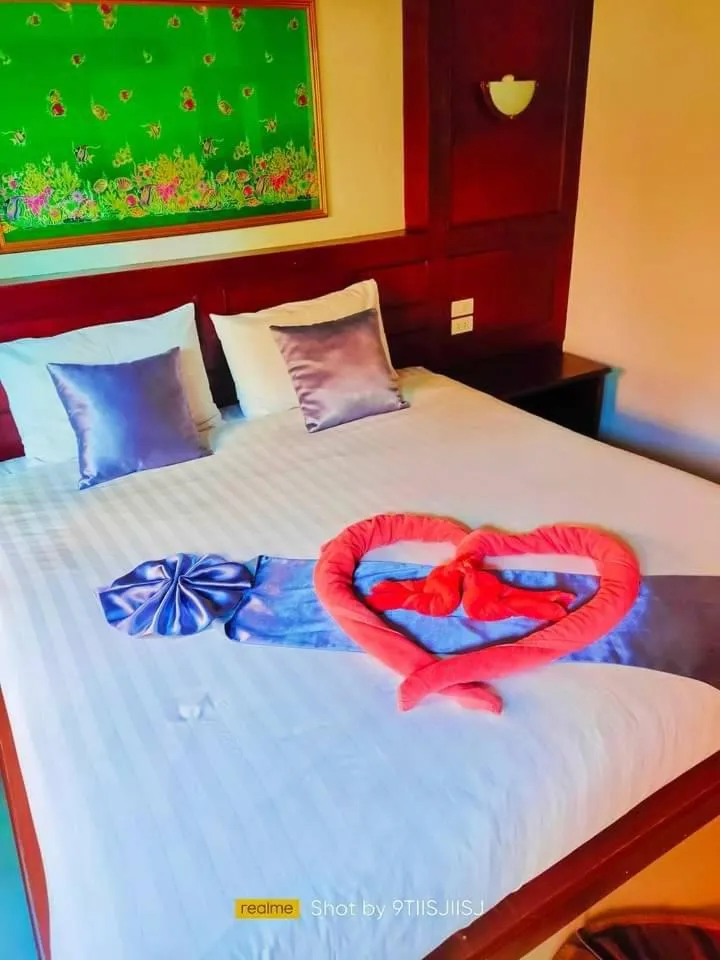 Bed in Tamarind Twin Resort