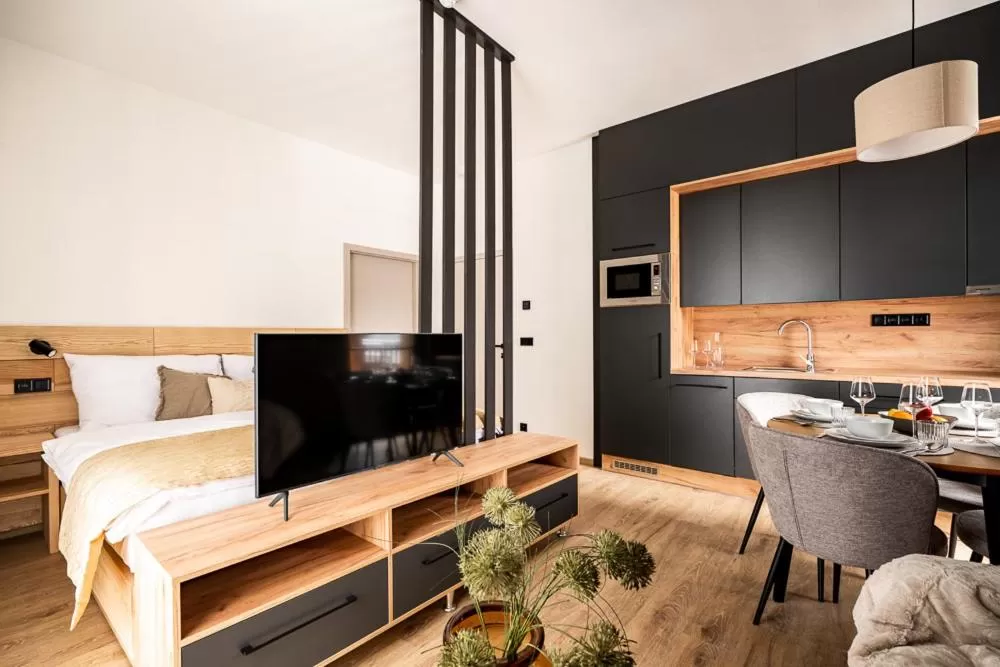 Bed, TV/Entertainment Center in Resort Aurum Residence A