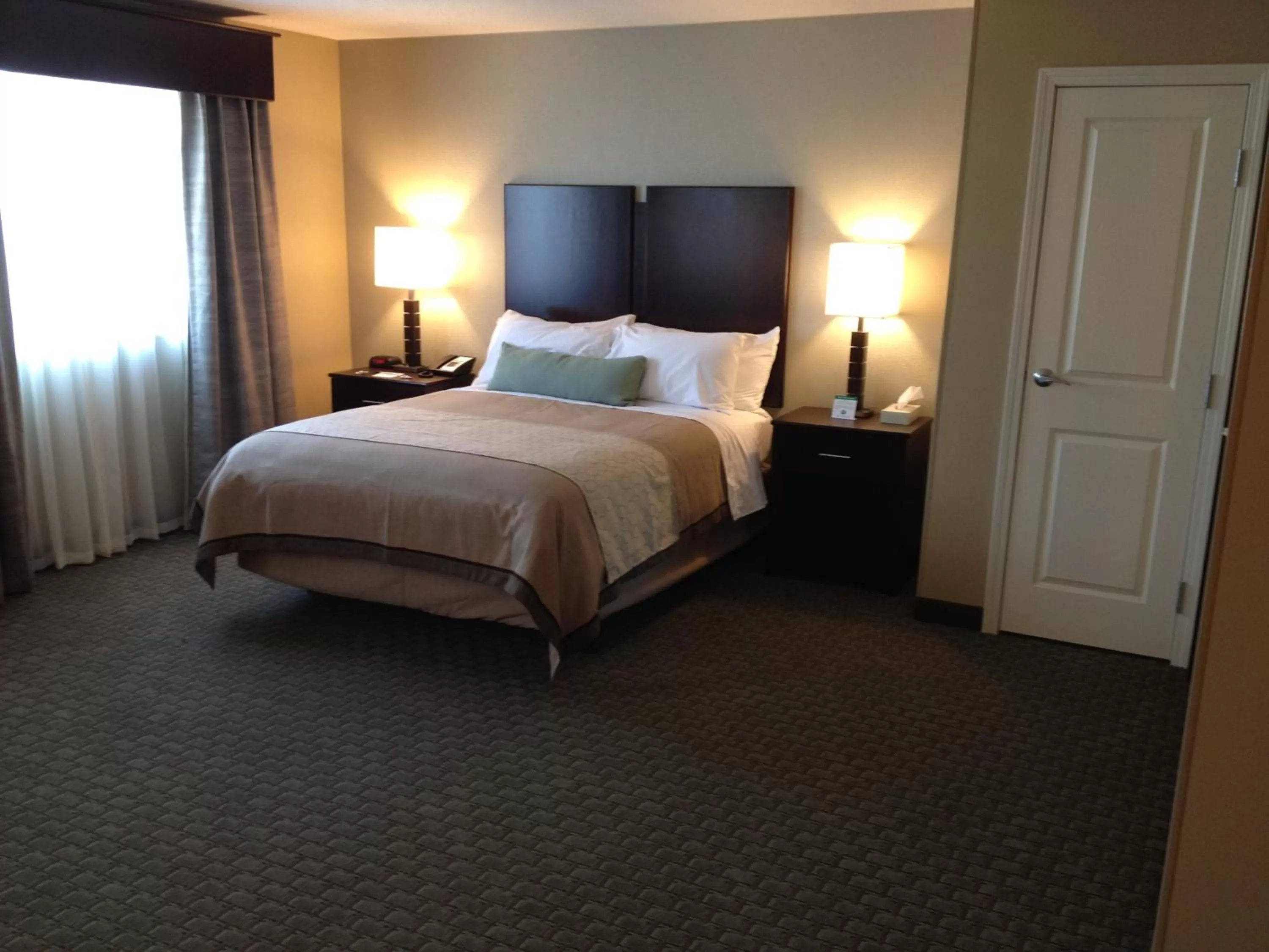 Bed in GrandStay Hotel & Suites - Glenwood