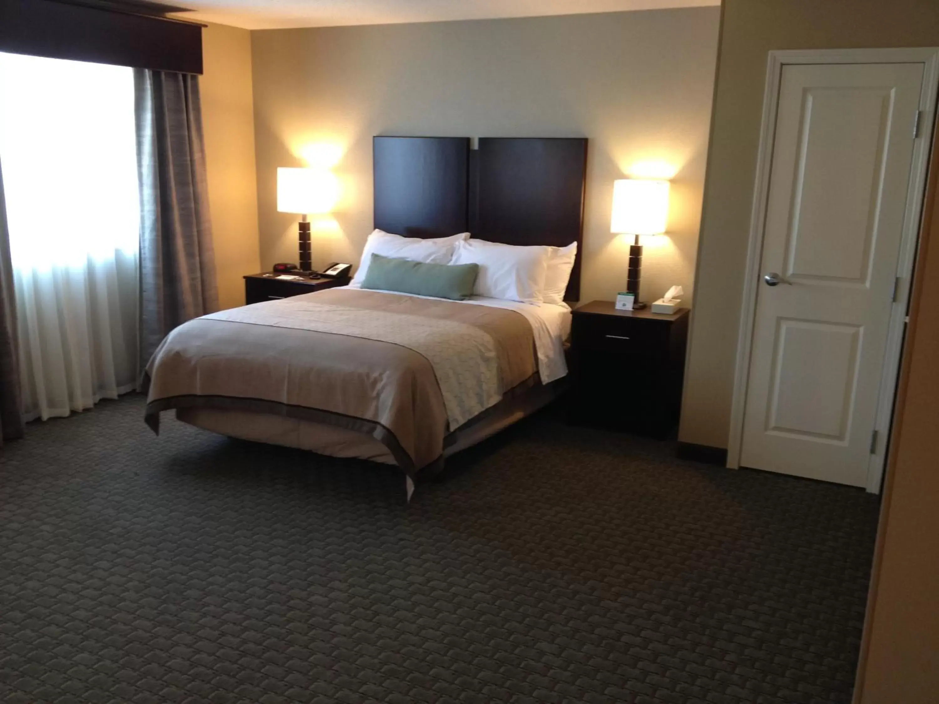 Bed in GrandStay Hotel & Suites - Glenwood