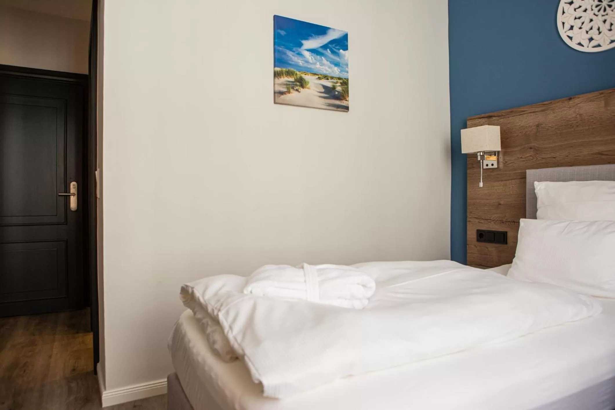 Bed in Romantik Hotel Aquarium