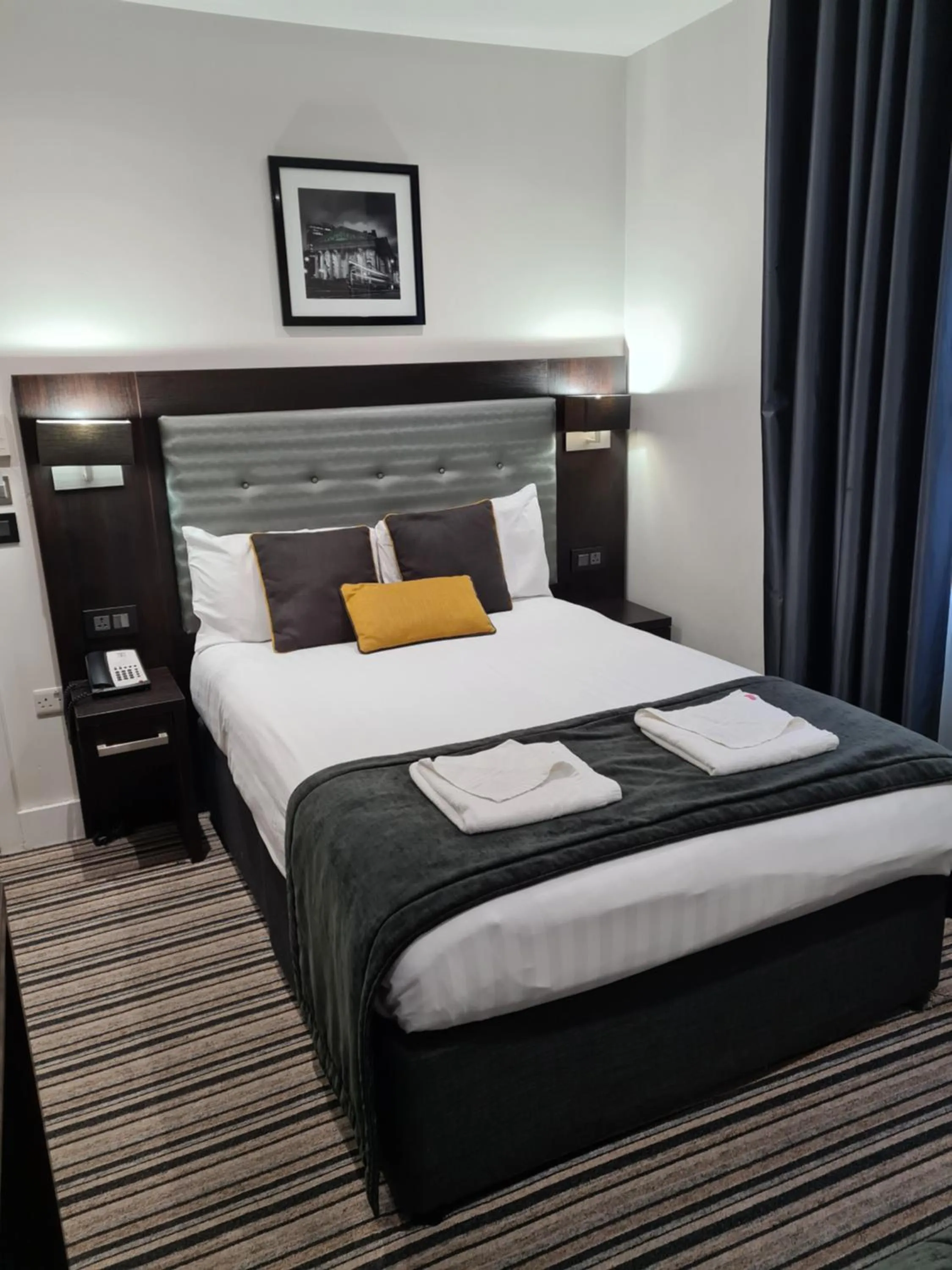 Bed in The Tudor Inn Hotel