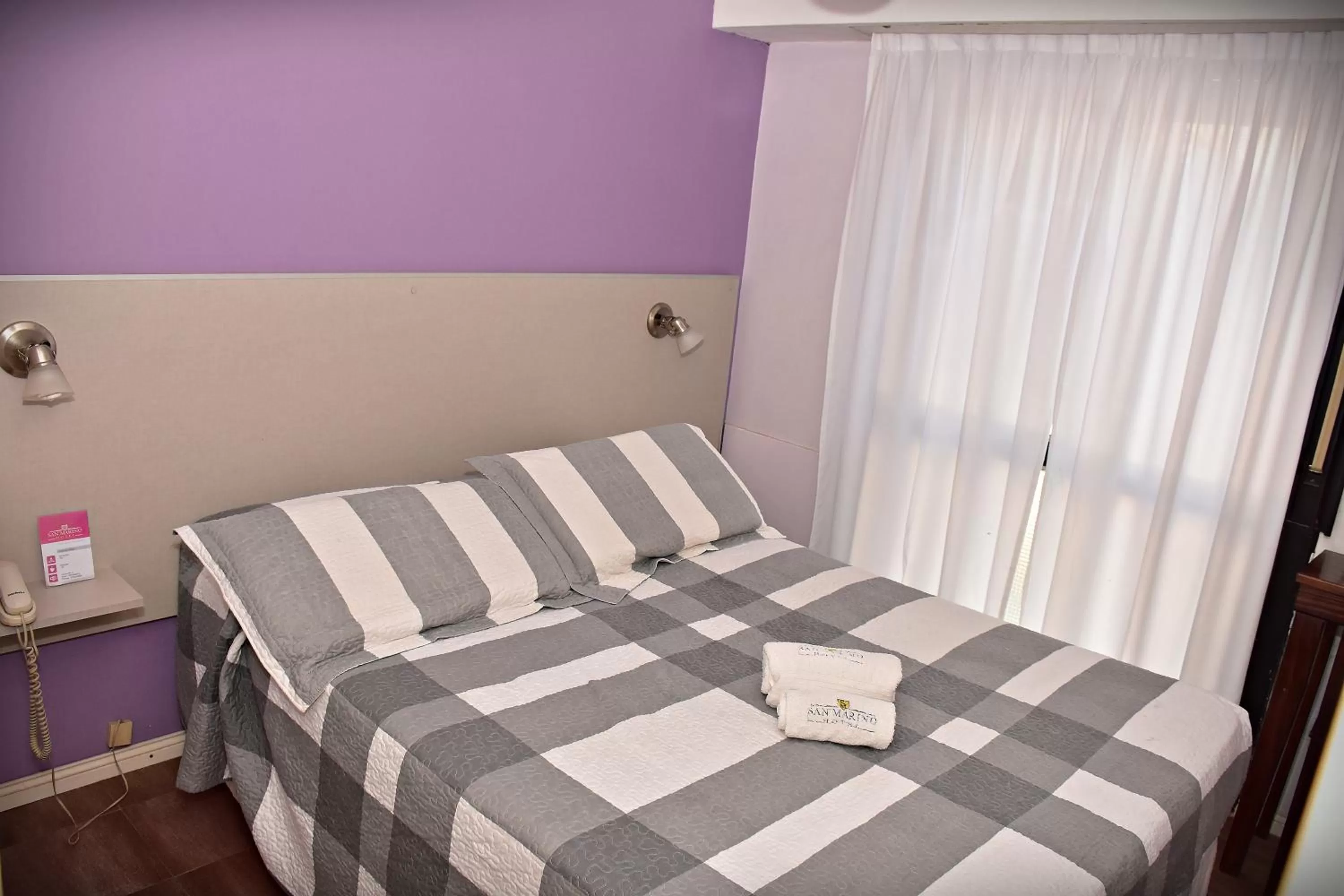 Bed in Hotel San Marino