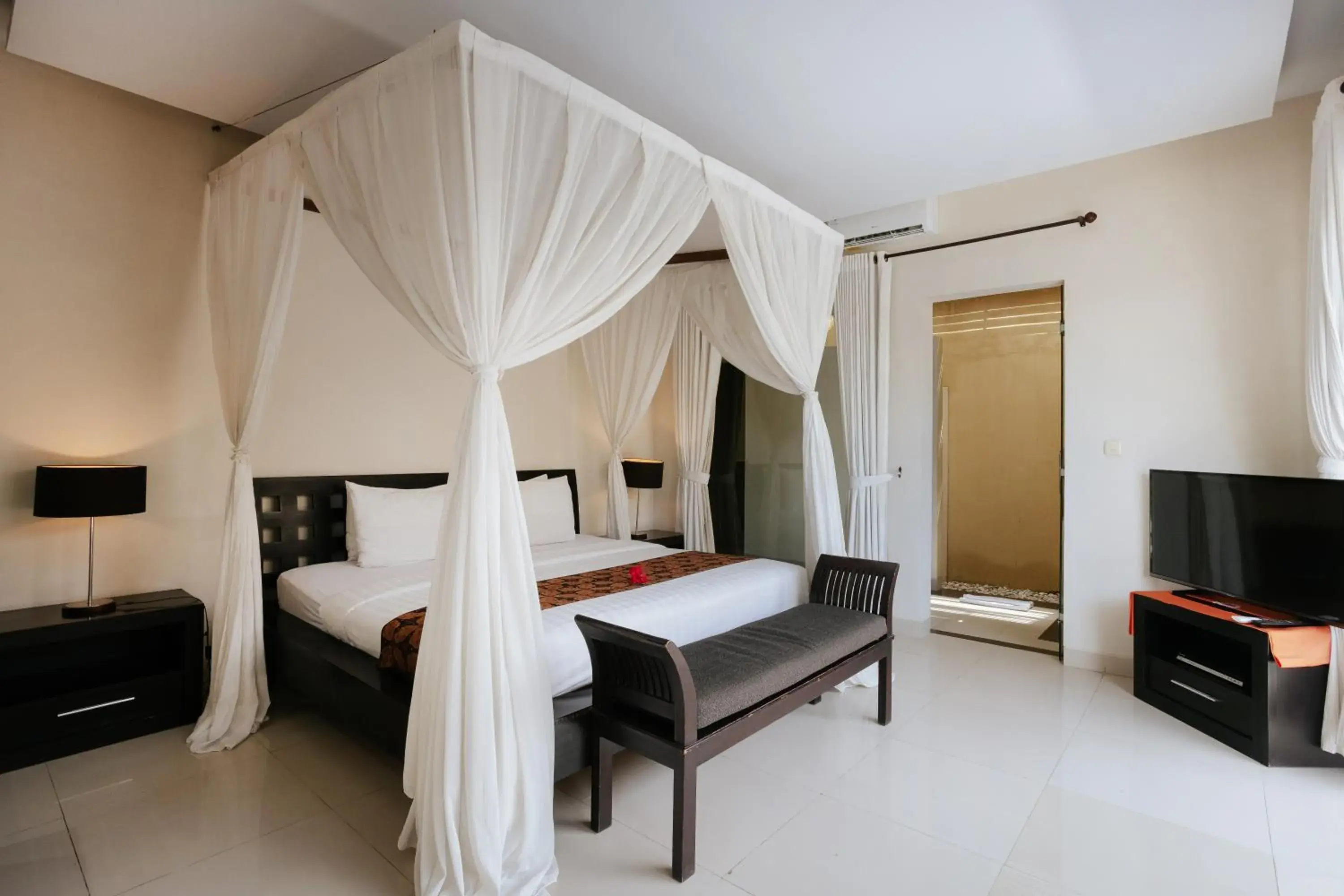 Bed in The Bidadari Villas and Spa