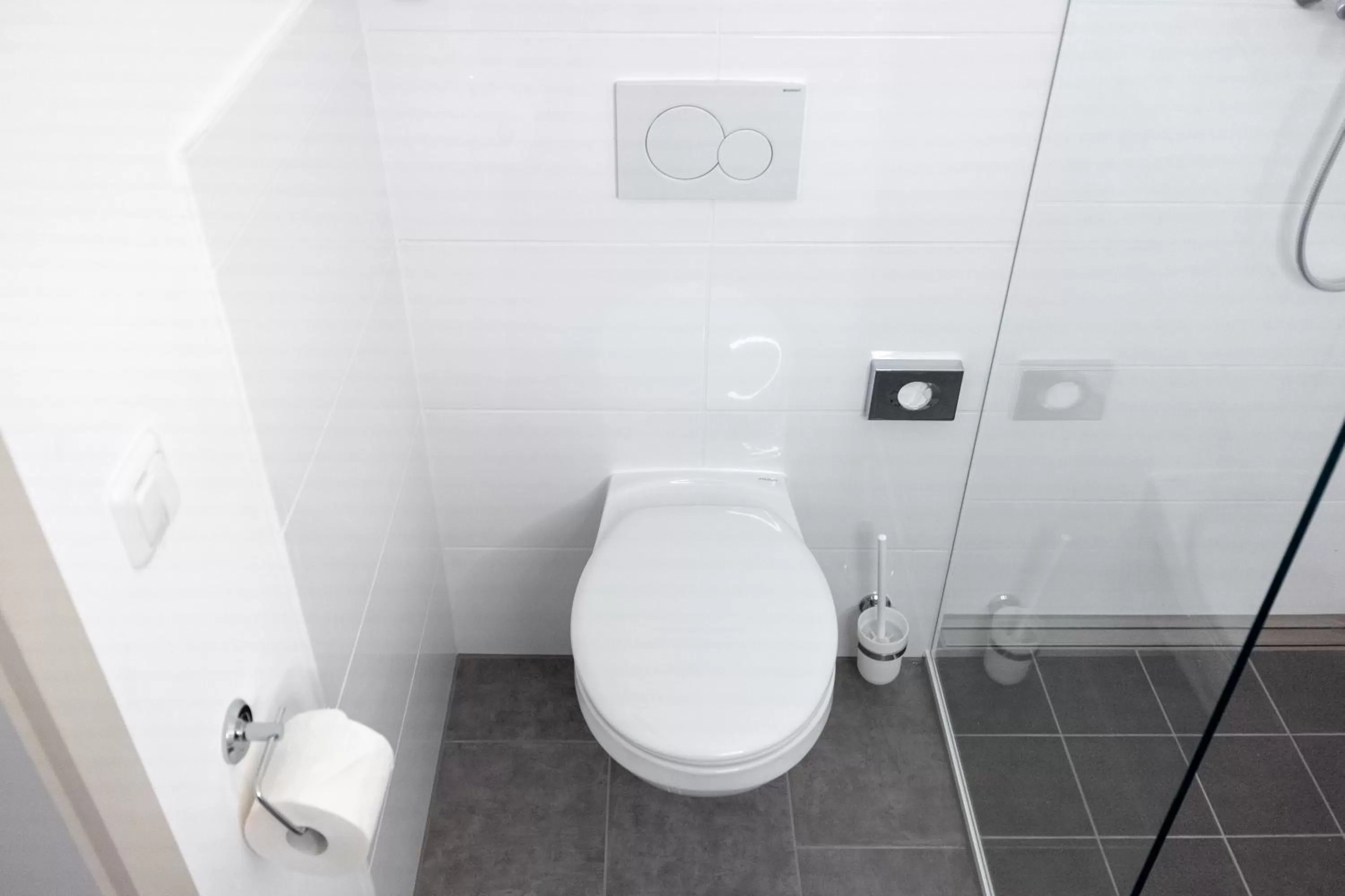 Toilet in ANA Living Augsburg City Center by Arthotel ANA - Self-Service-Hotel