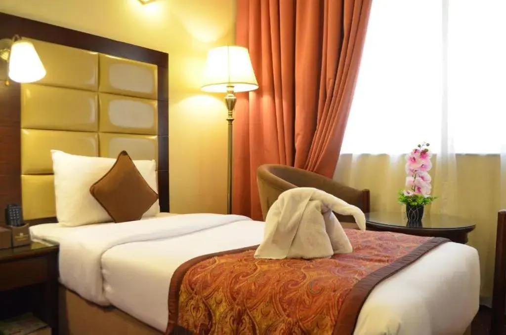 Bed in Orchid Hotel