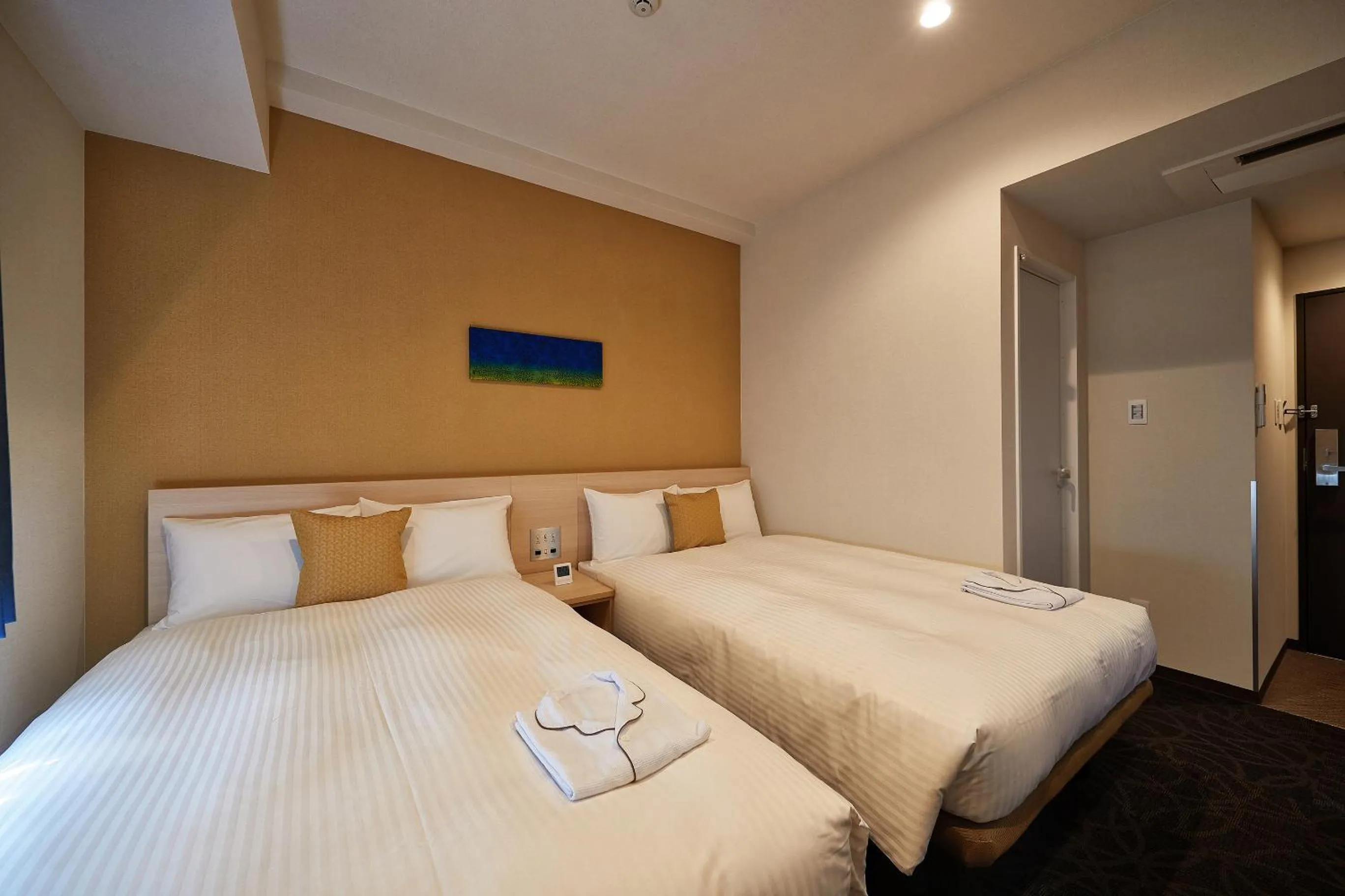 Bed in Y's Inn Naha Oroku Ekimae