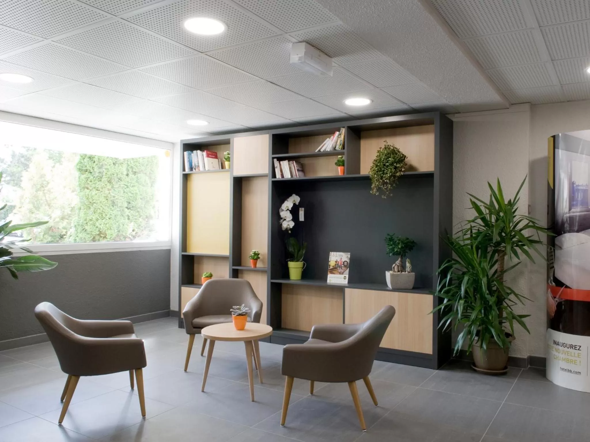 Communal lounge/ TV room in B&B HOTEL Saint-Quentin