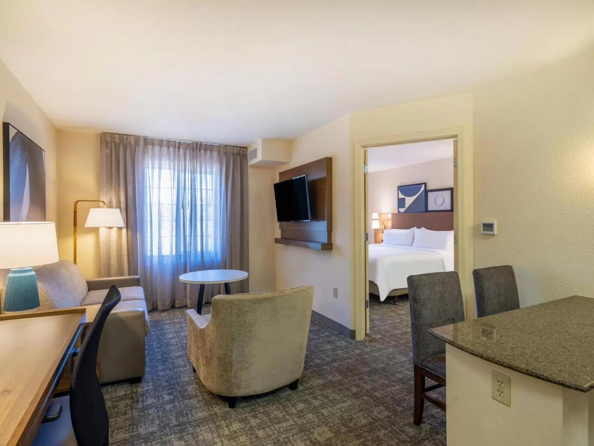 Bedroom, Seating Area in Staybridge Suites Milwaukee Airport South, an IHG Hotel