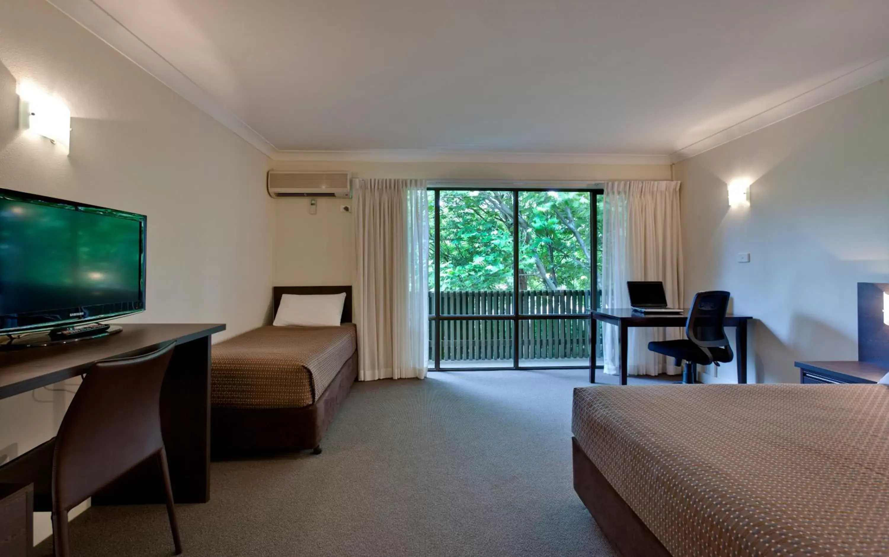 Photo of the whole room, TV/Entertainment Center in ibis Styles Canberra Tall Trees Hotel