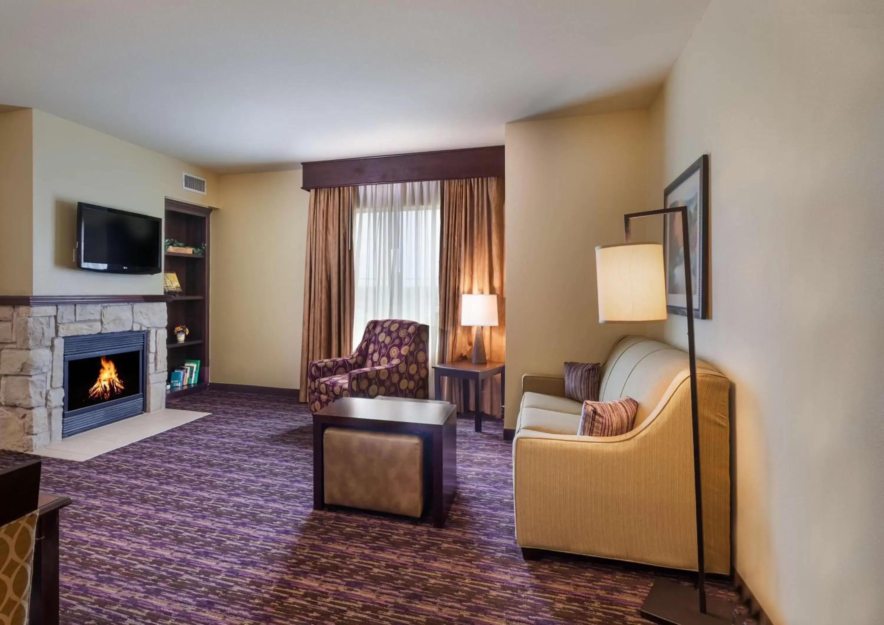 Bed, Seating Area in Homewood Suites Wichita Falls