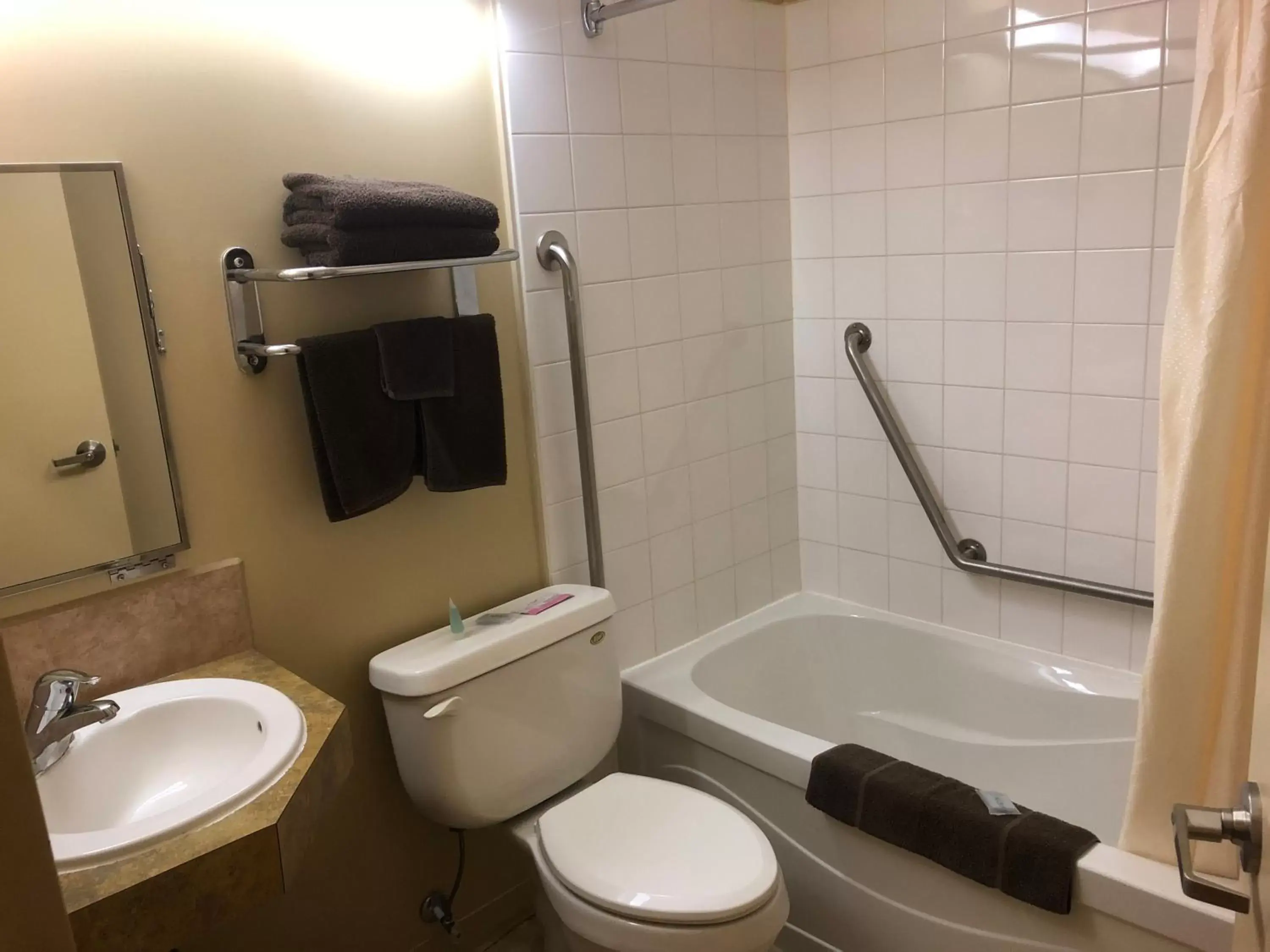 Bathroom in Travel Inn & Suites