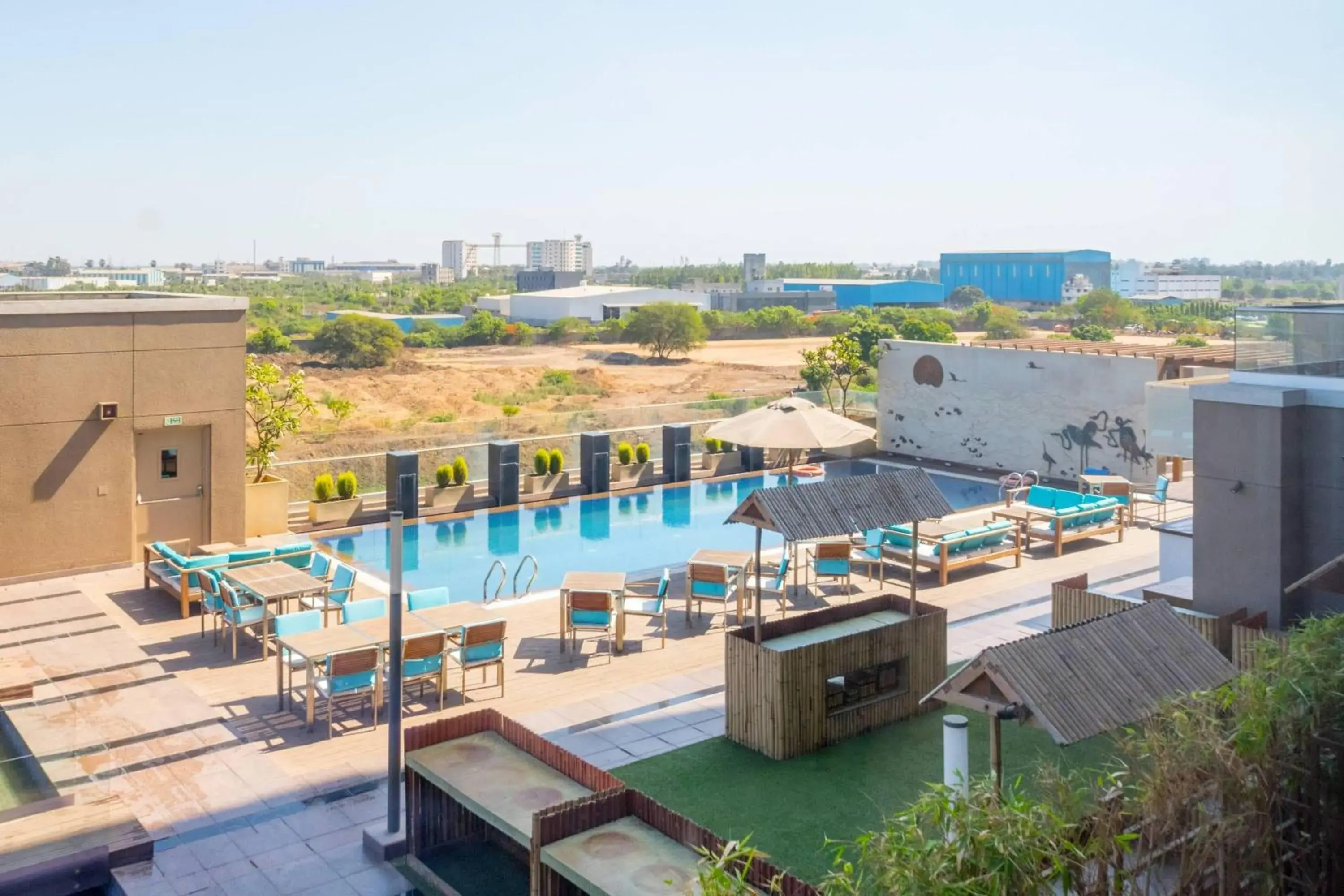 Photo of the whole room, Pool View in Courtyard by Marriott Surat