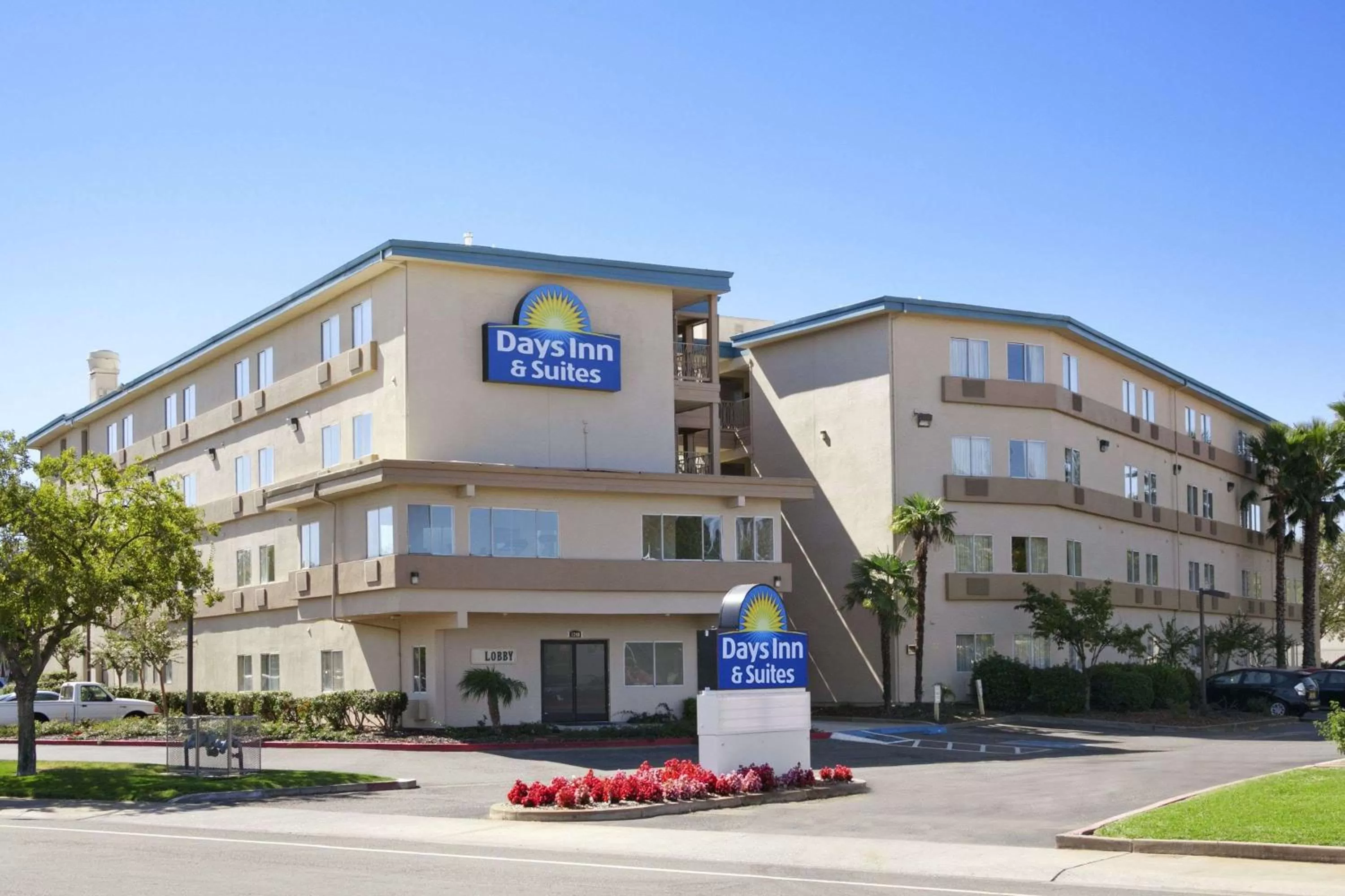 Property building in Days Inn & Suites by Wyndham Rancho Cordova