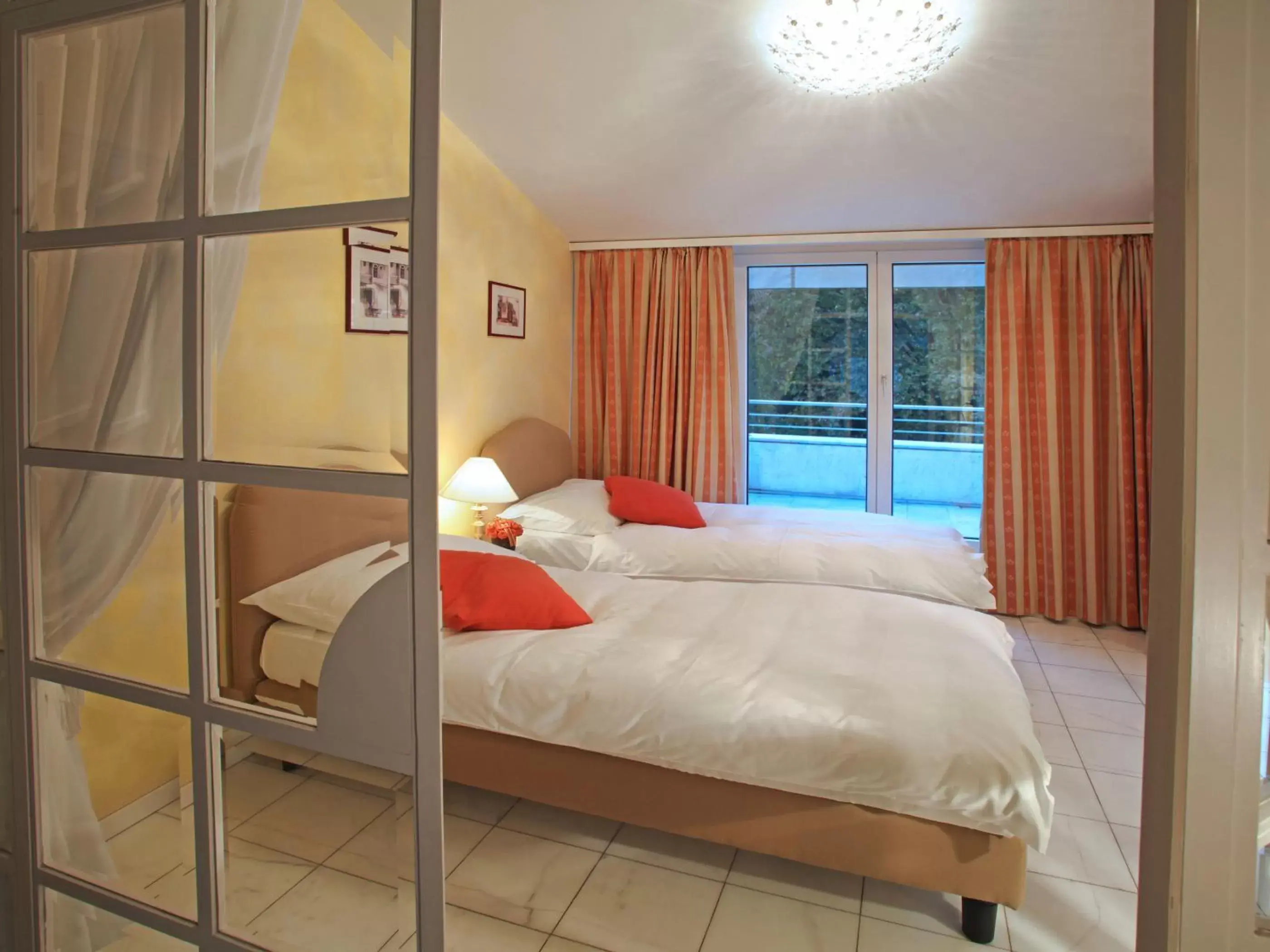 Bedroom in Villa Sassa Hotel, Residence & Spa - Ticino Hotels Group