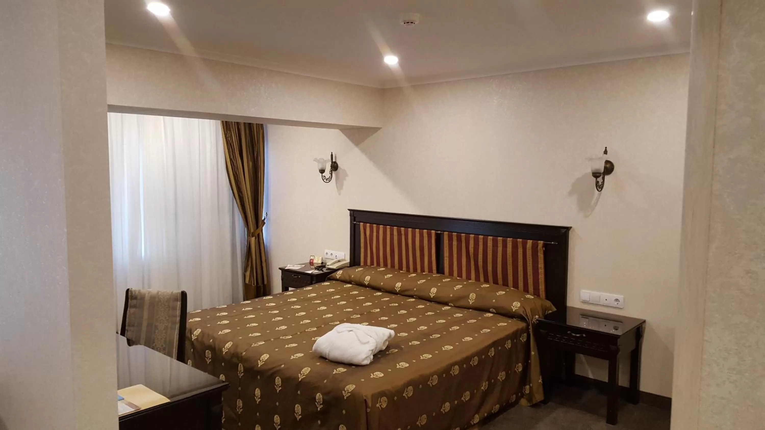 Bed in Grand Mir Hotel