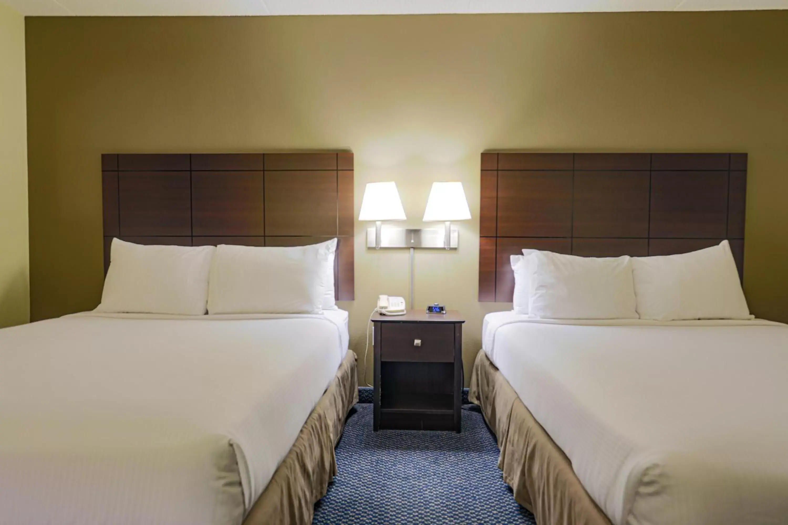 Bed in AmericInn by Wyndham Lincoln South