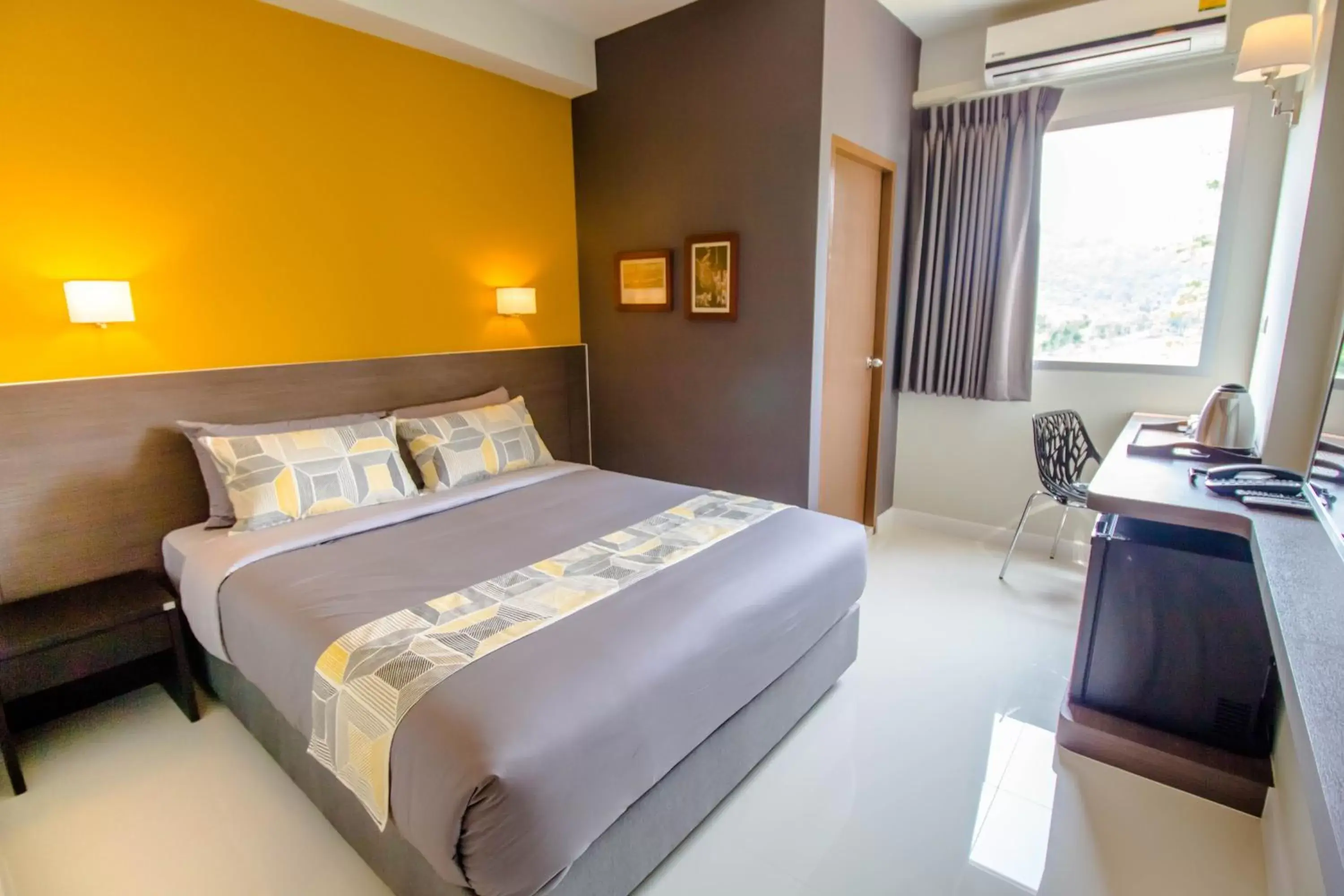 Bed in Fortune D Hotel Loei