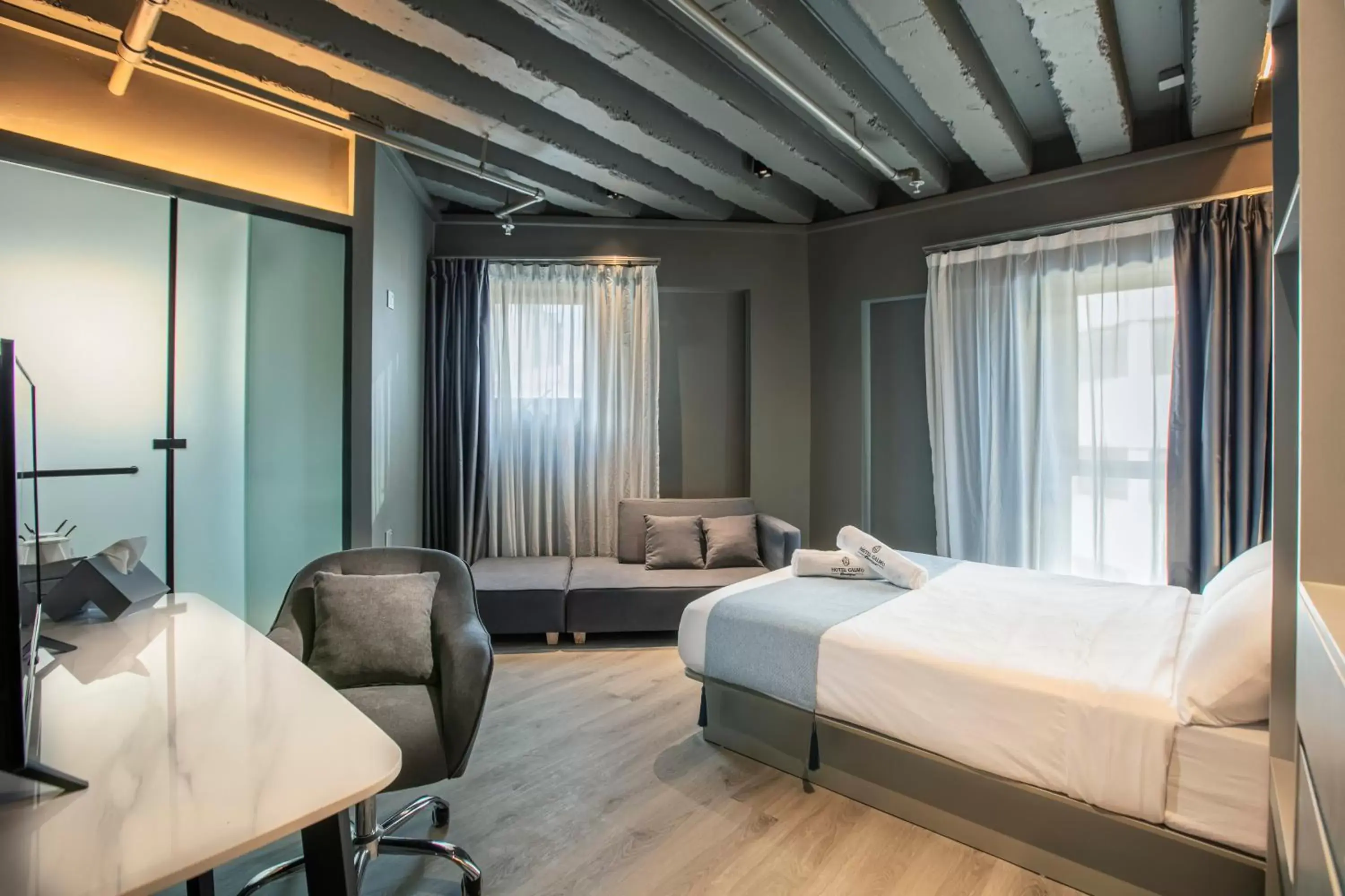 Bed in Hotel Calmo Bugis Bed in Hotel Calmo Bugis