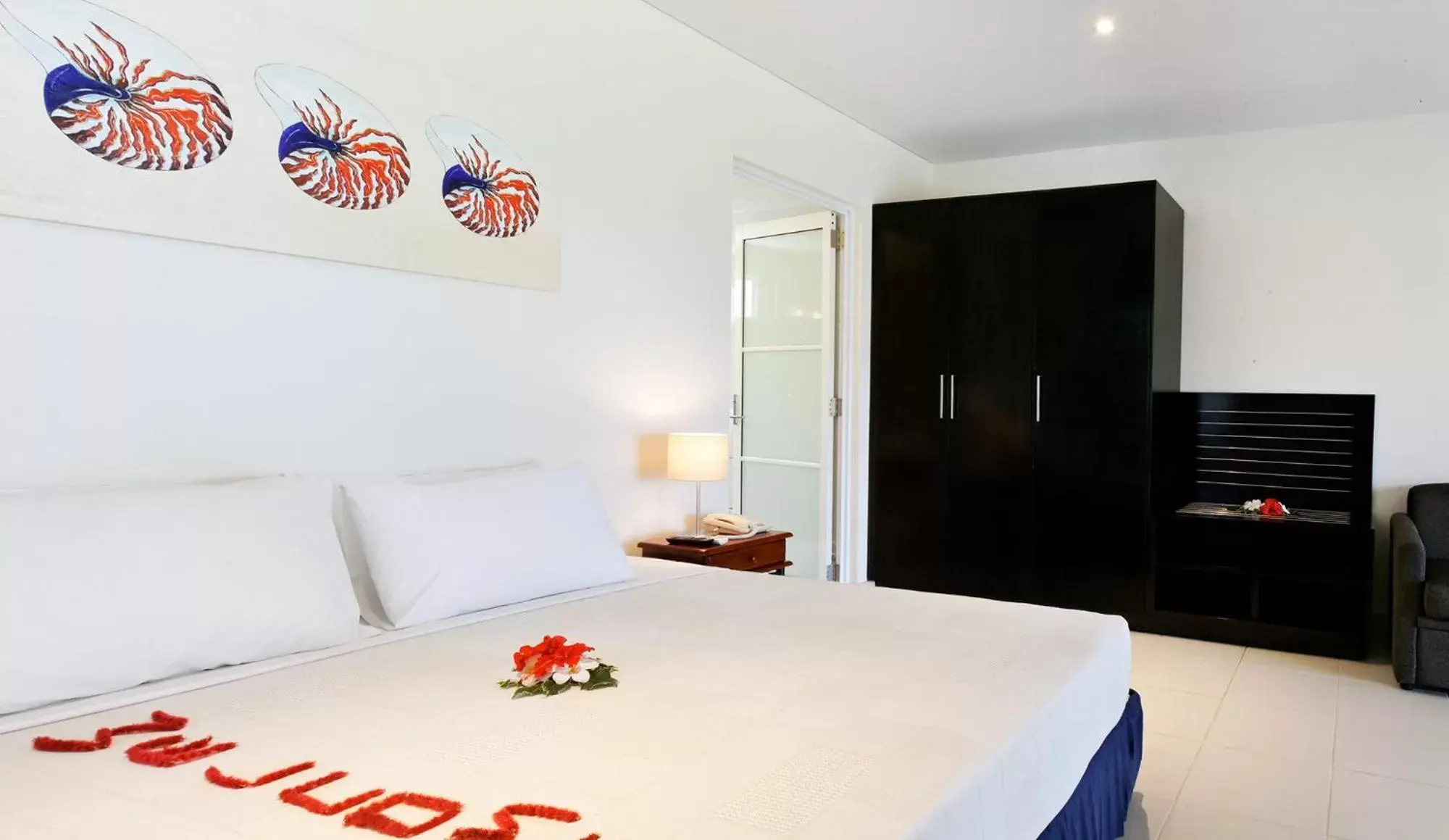 Bed in First Landing Beach Resort & Villas