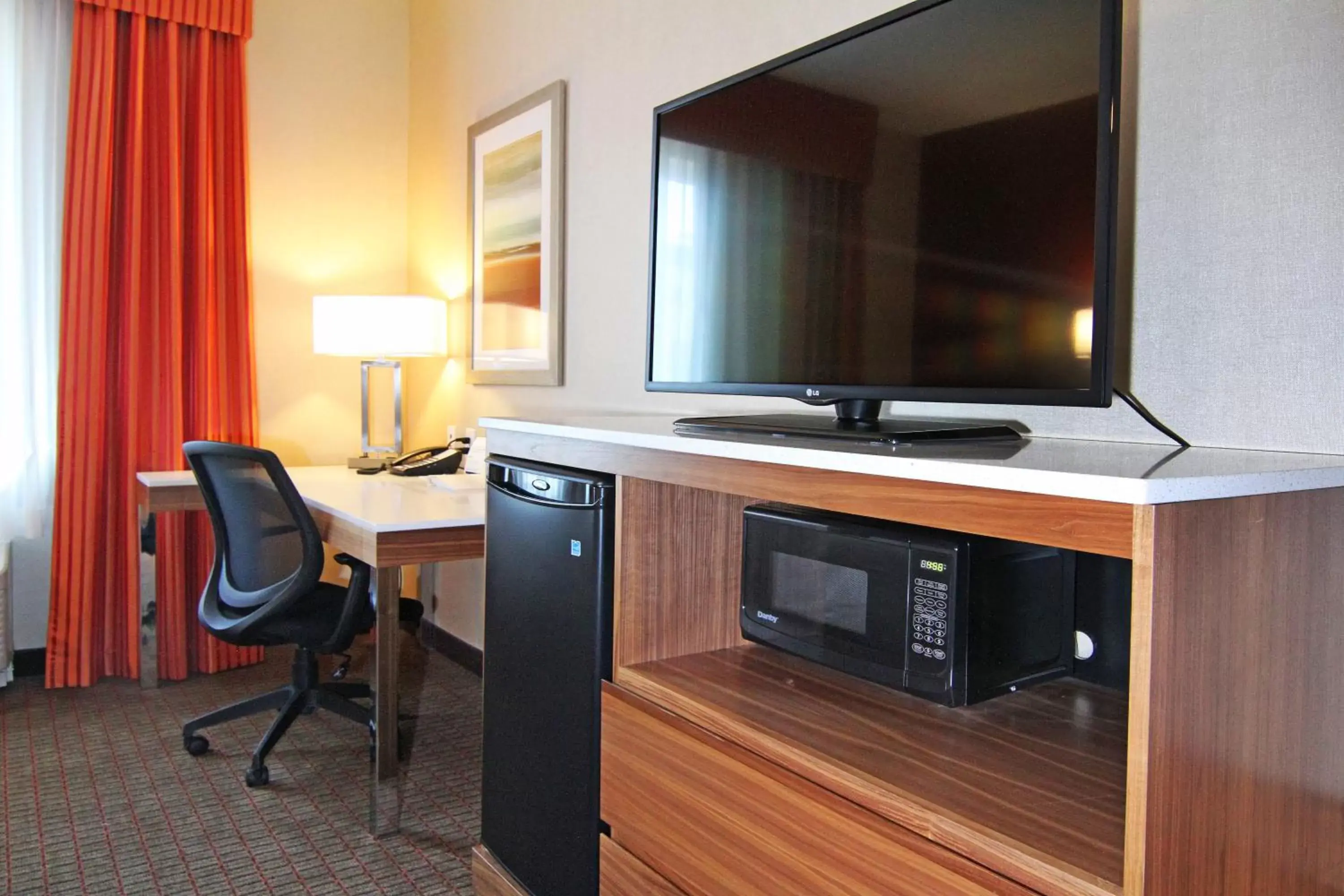 Photo of the whole room, TV/Entertainment Center in Holiday Inn Express and Suites Calgary University, an IHG Hotel