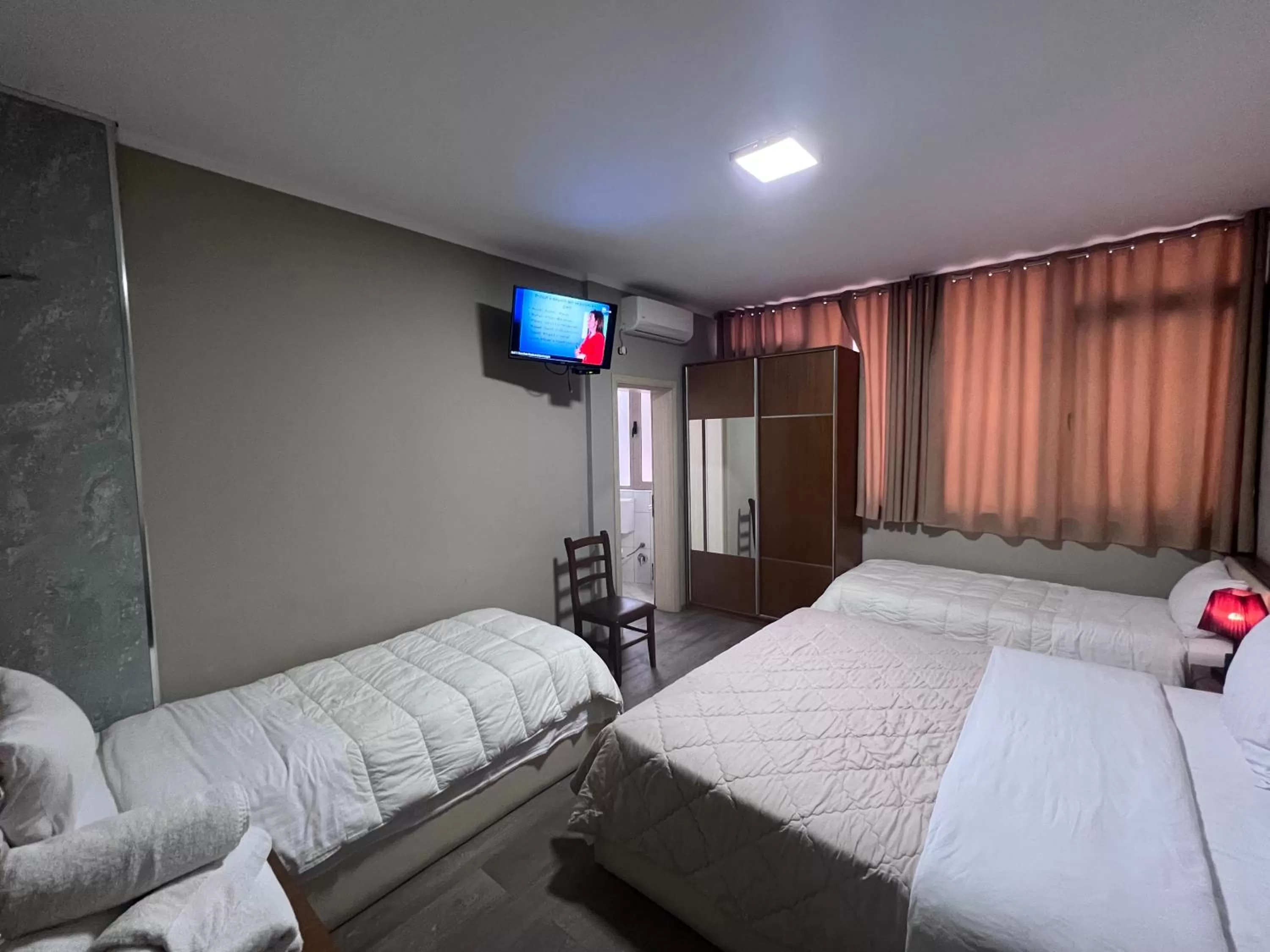 Communal lounge/ TV room, Bed in Bobi Hotel