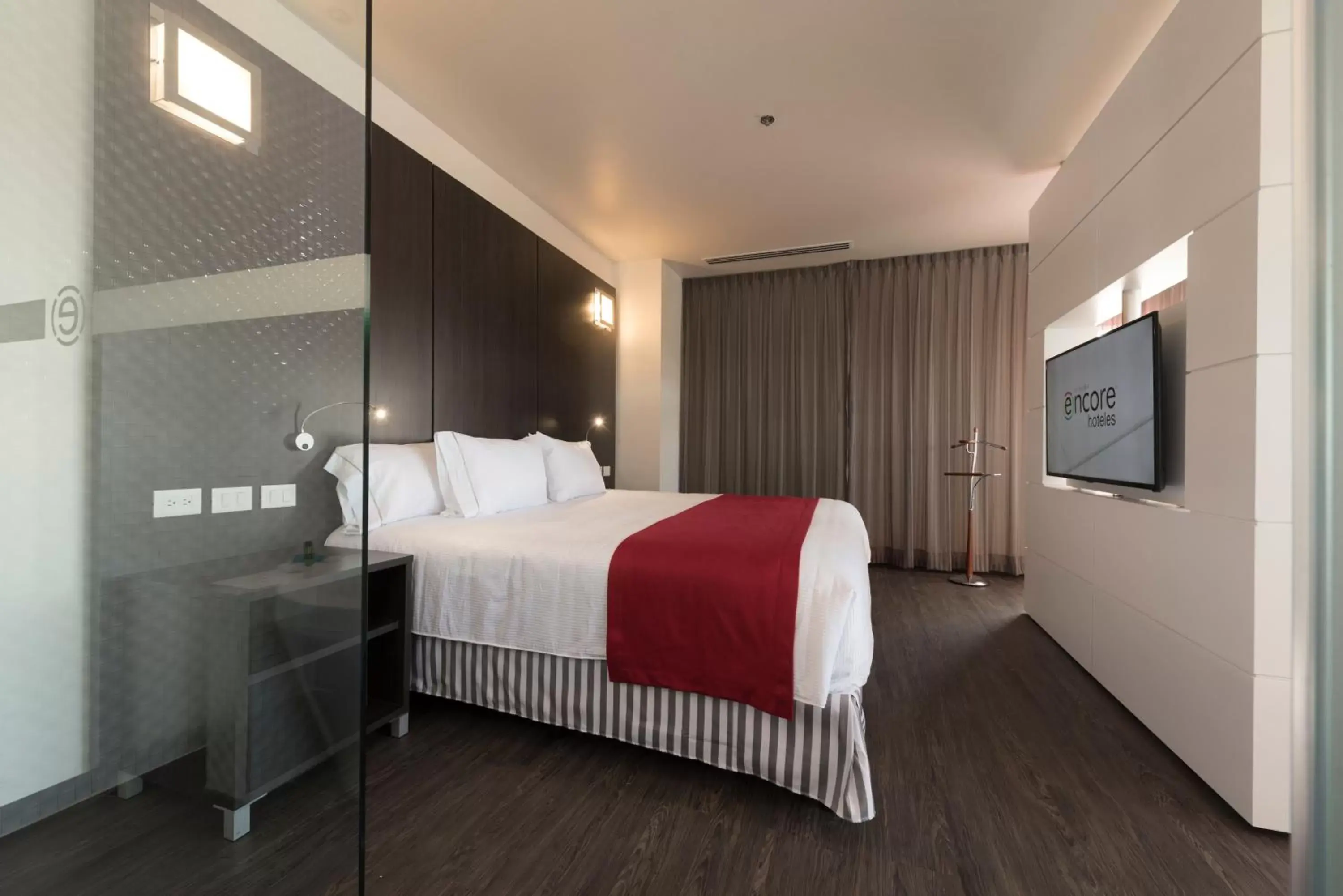 Bed in Ramada Encore by Wyndham Puebla