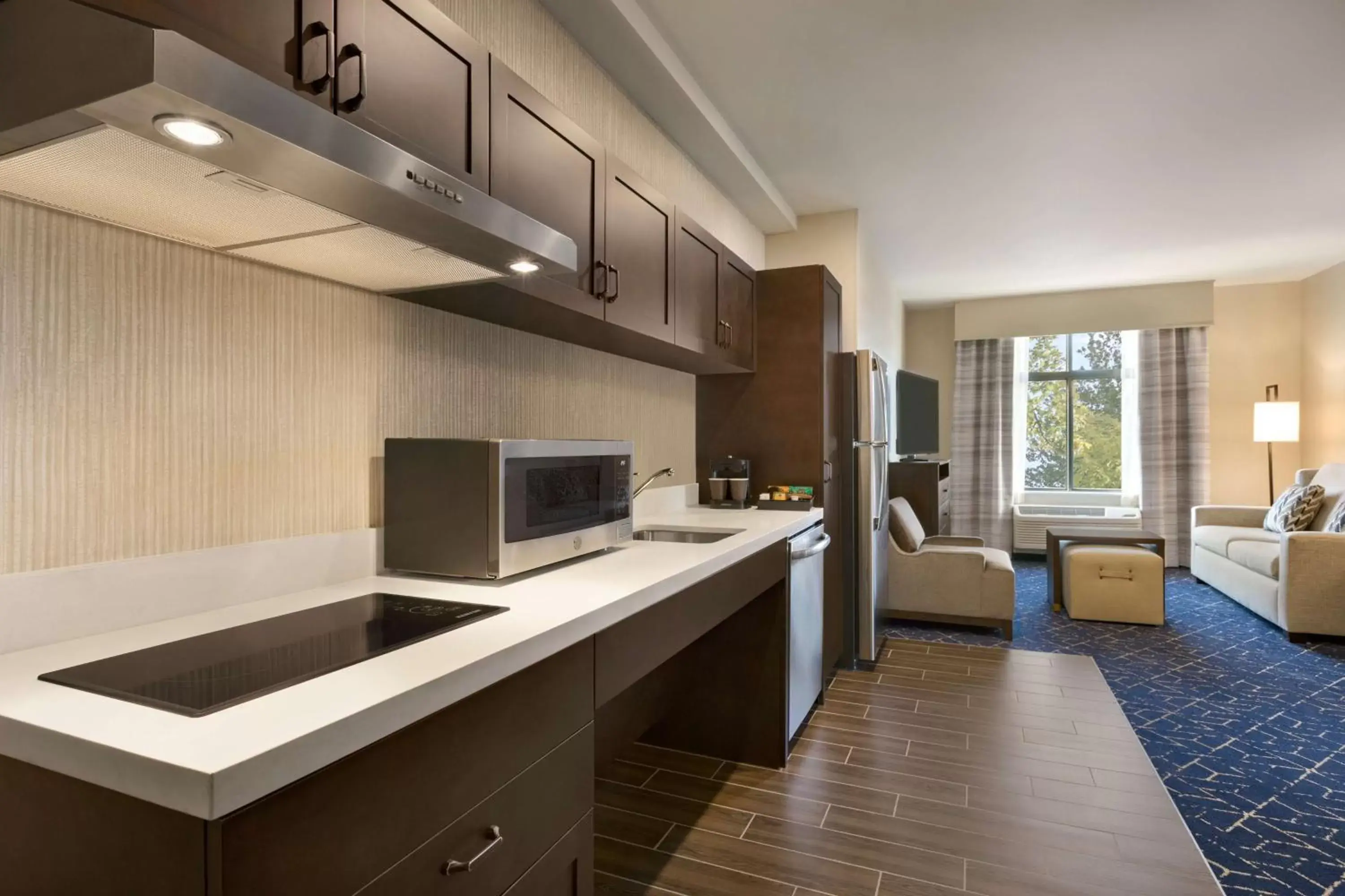 Living room, Kitchen/Kitchenette in Homewood Suites by Hilton Albany Crossgates Mall