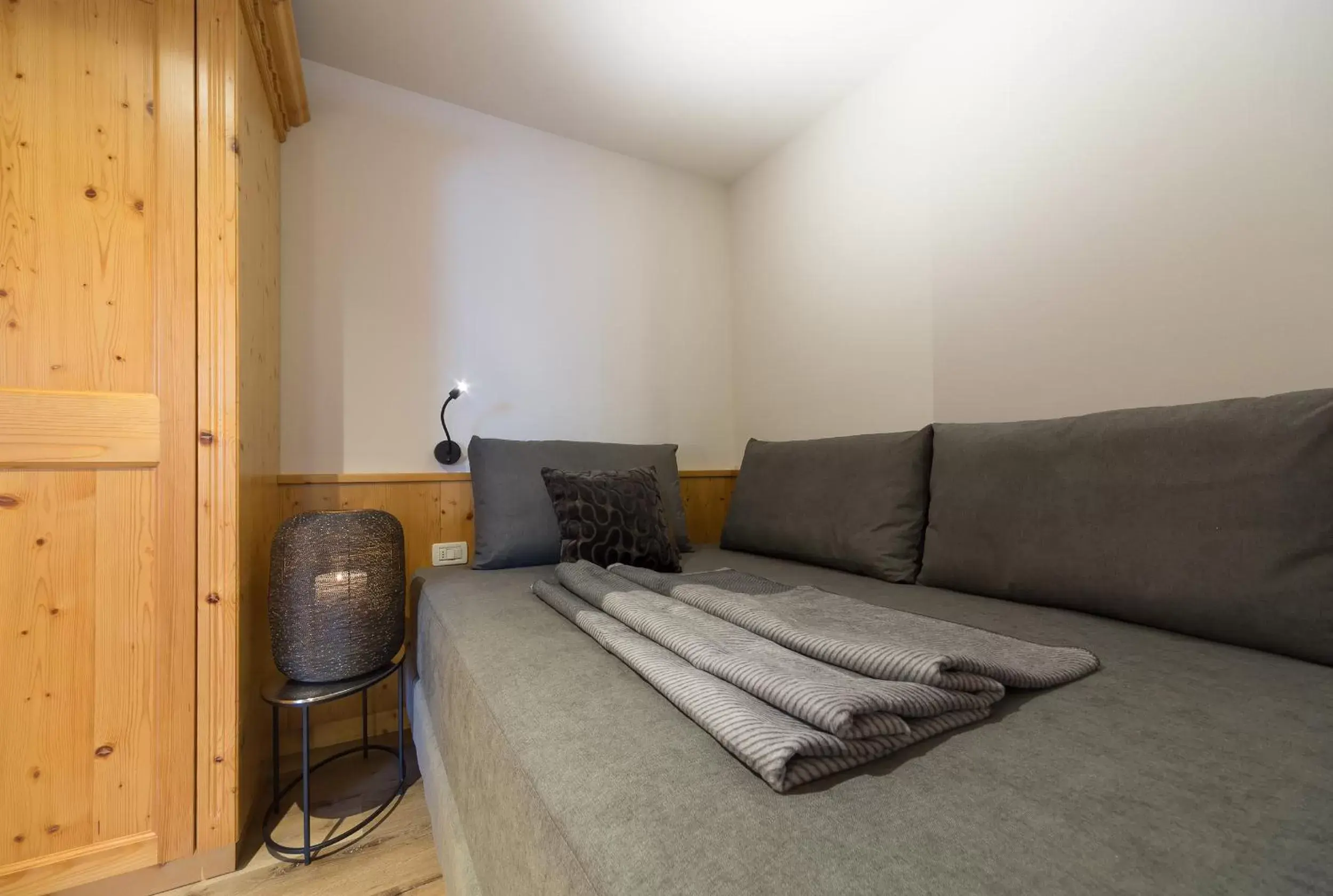 Bed, Seating Area in Eden Apartments