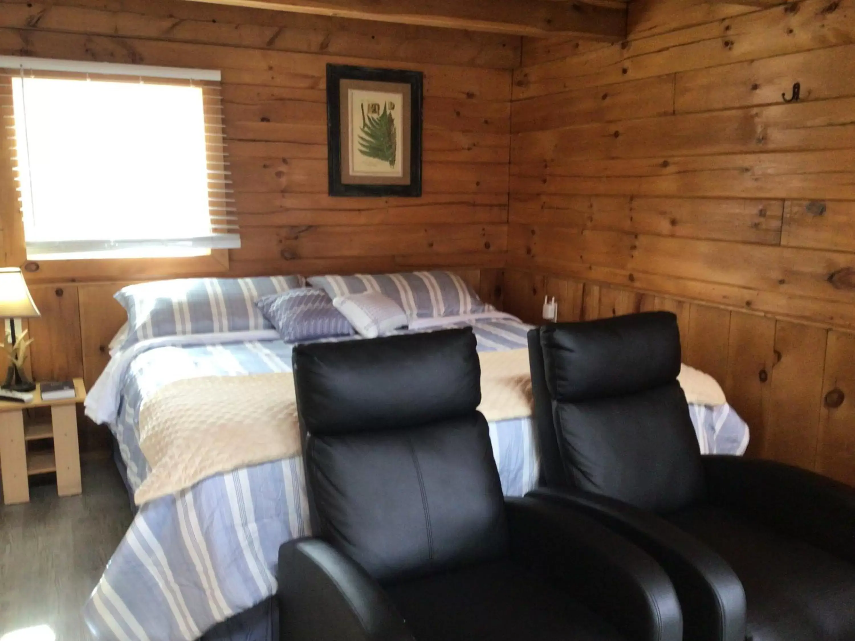 Bed in Kozy Haven Log Cabin Rentals