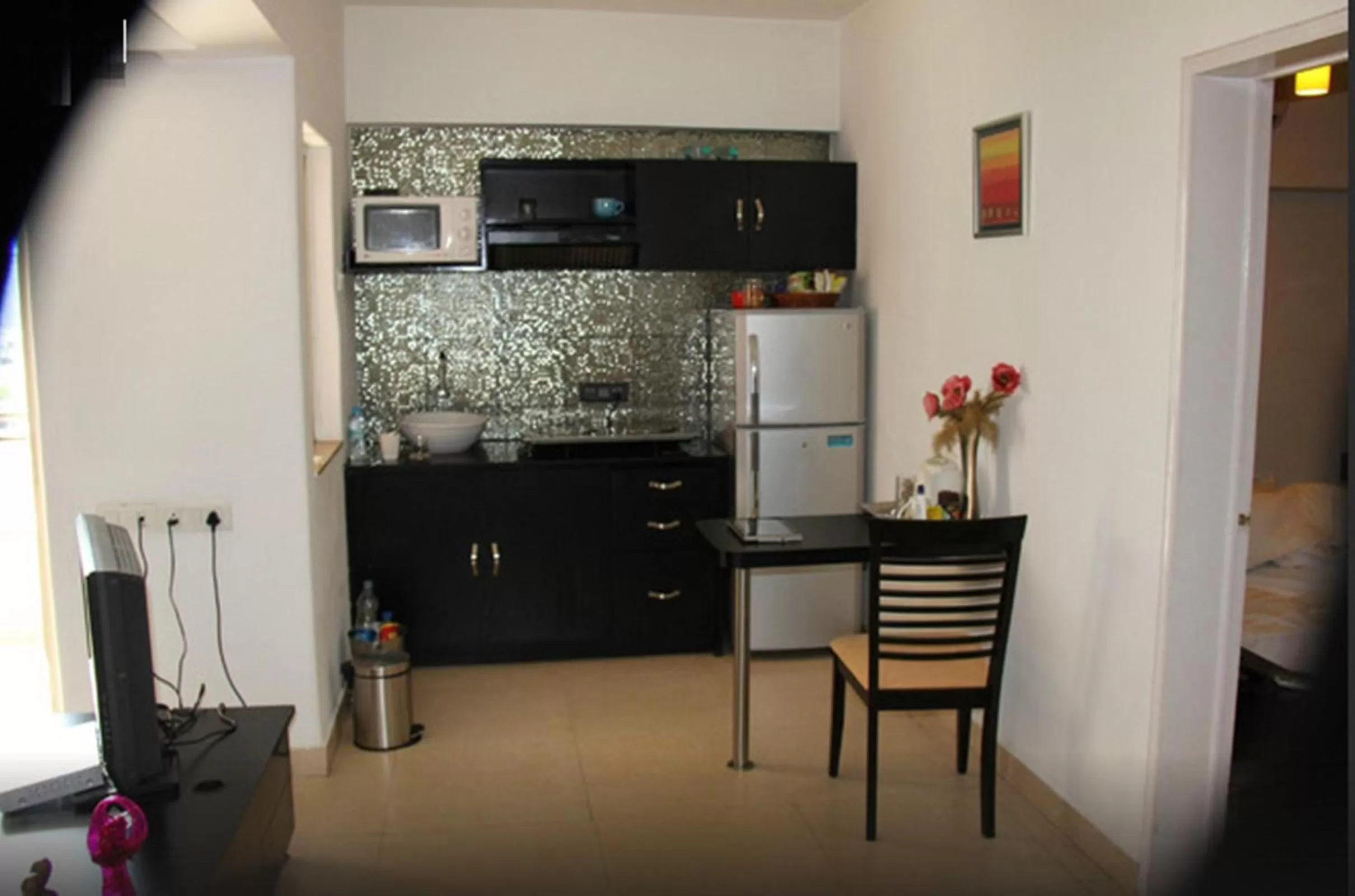 Kitchen or kitchenette in Royal Orchid Golden Suites Pune