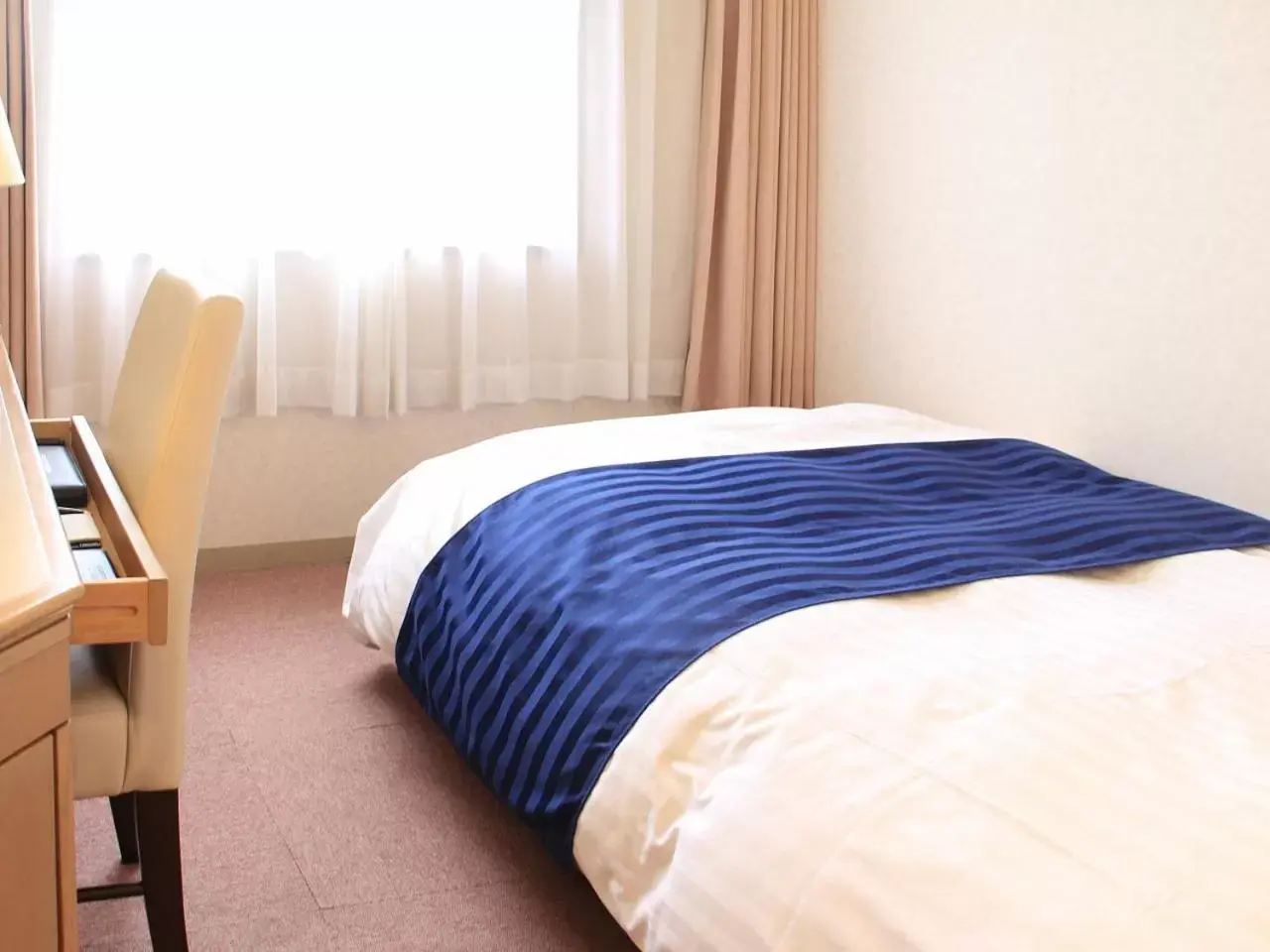 Bed in HOTEL LiVEMAX BUDGET Kagoshima