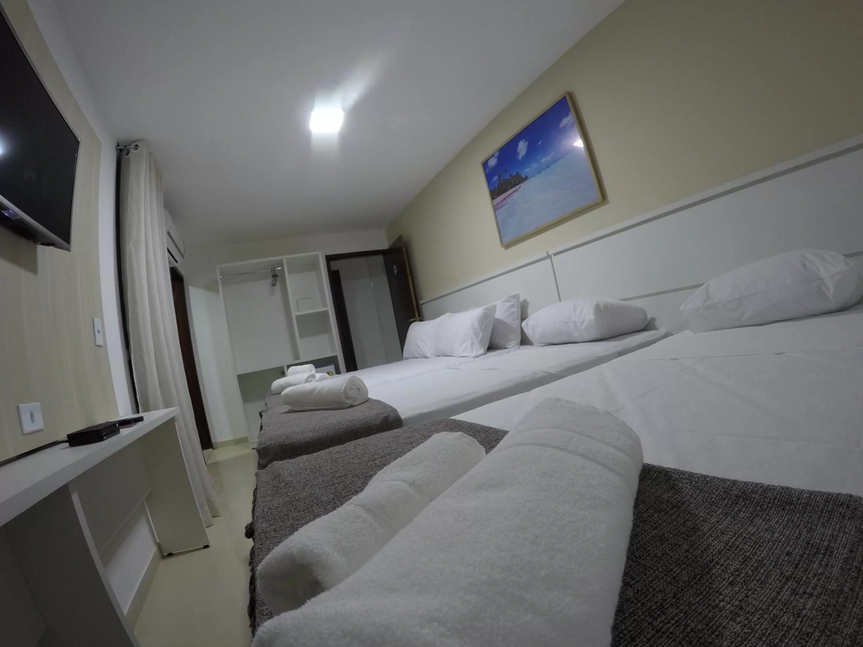 Bed in Pousada Kanoas