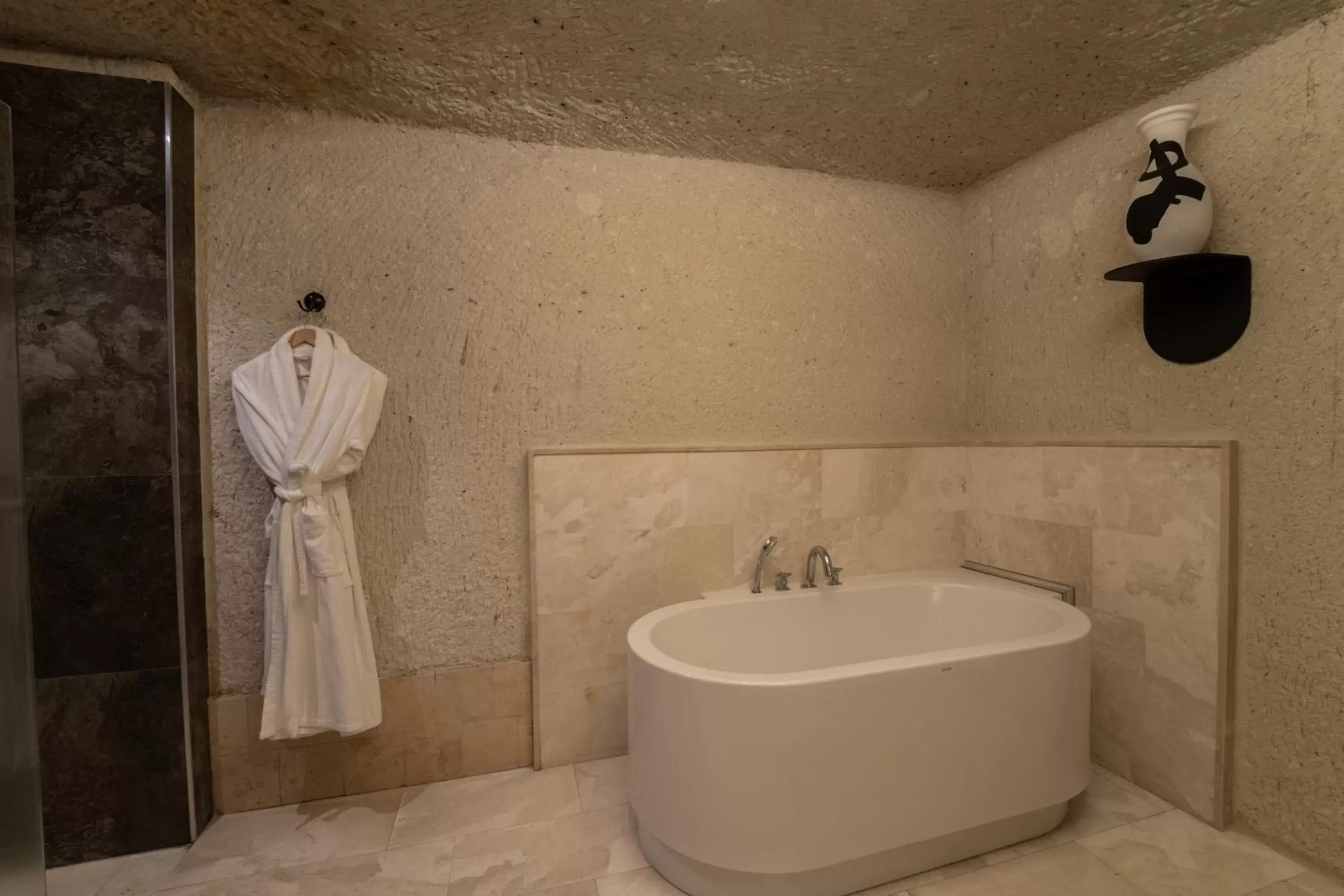 Bathroom in Artemis Cave Suites & Spa- Adults Only