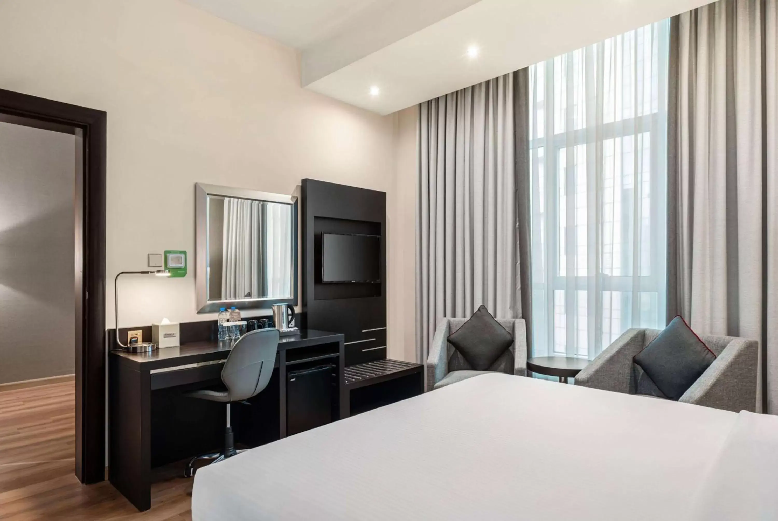 Photo of the whole room, Bed in Ramada by Wyndham Dubai Barsha Heights