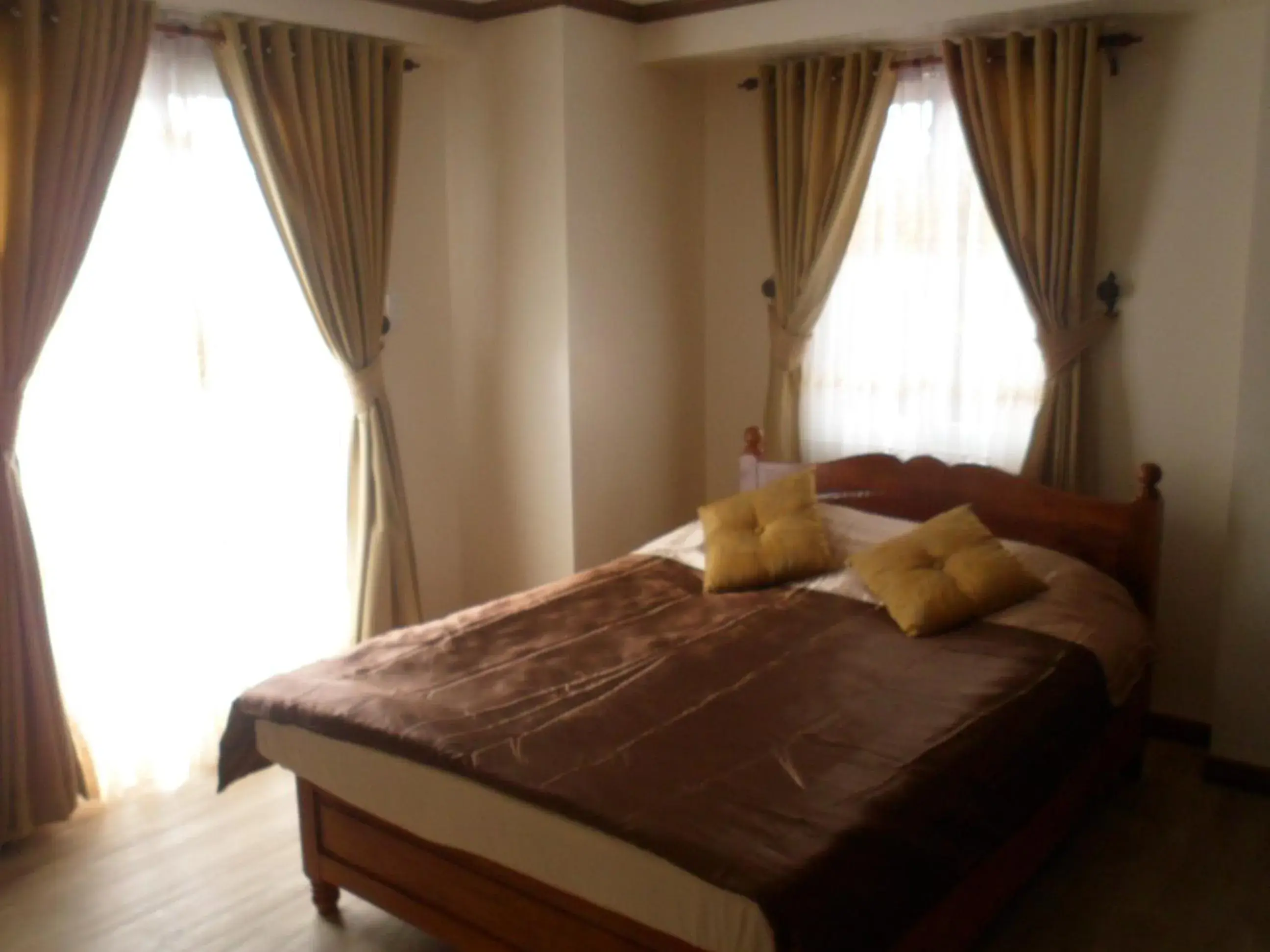 Bed in Prestige Vacation Apartments - Bonbel Condominium