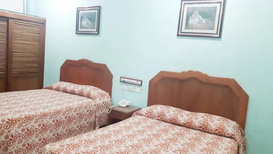 Bed in Hotel Azteca Tabasco