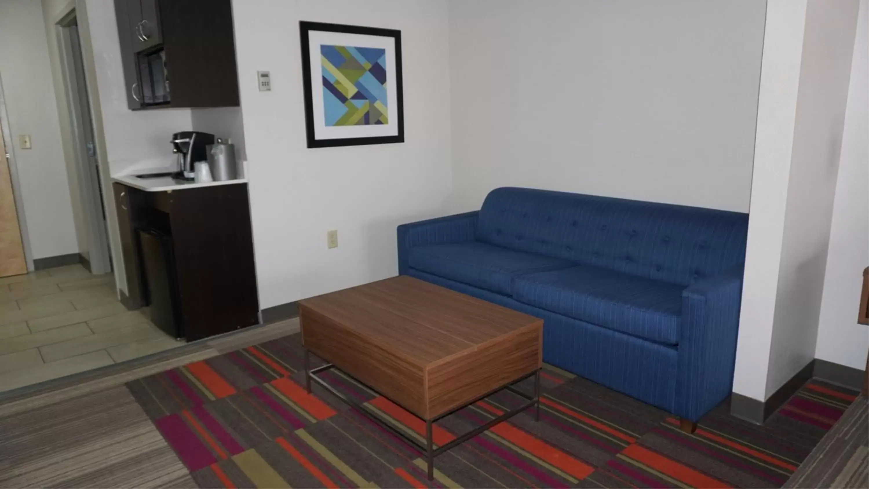 Bedroom, Seating Area in Holiday Inn Express Hotel & Suites Greensboro-East, an IHG Hotel