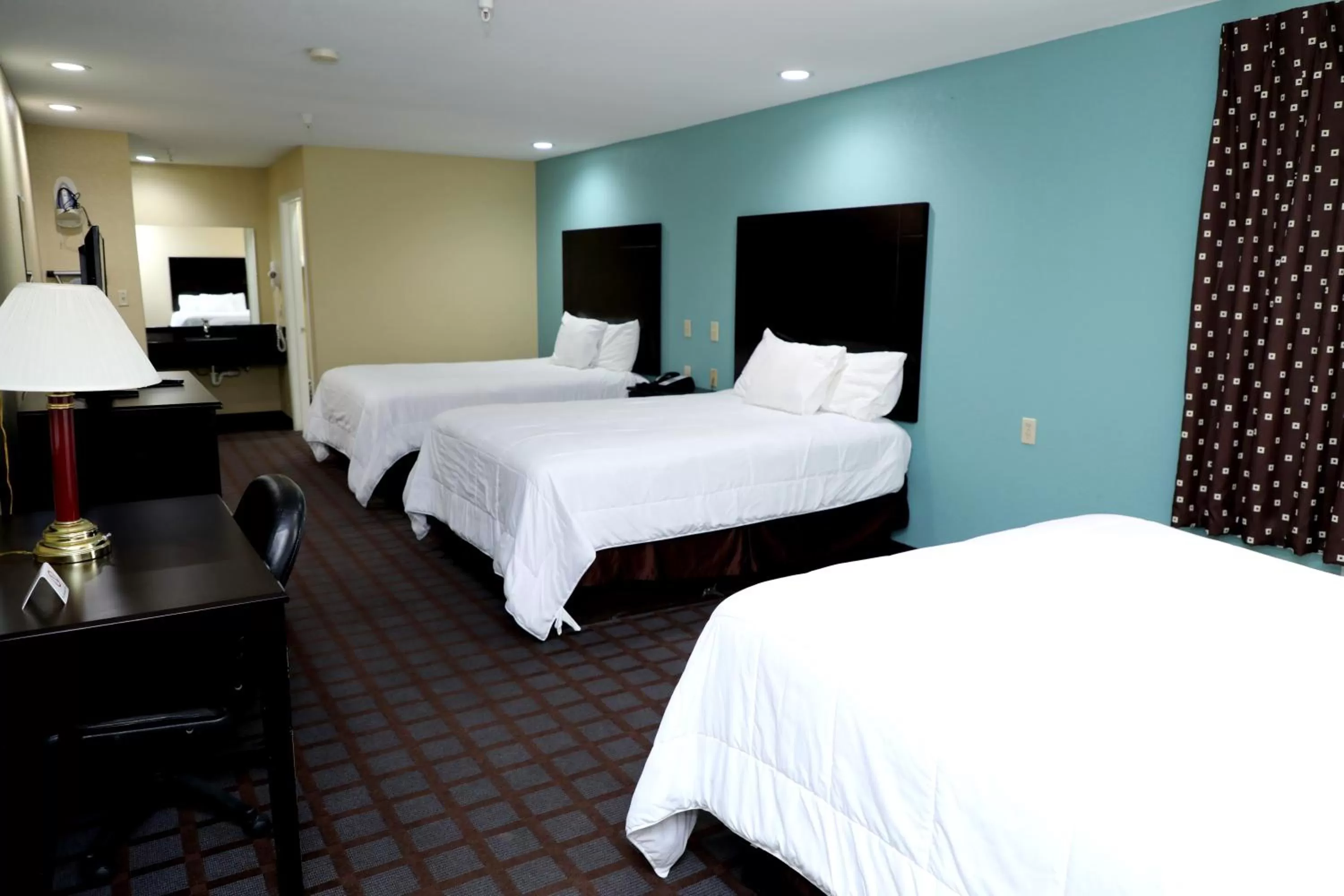 Bed in Ranger Inn & Suites