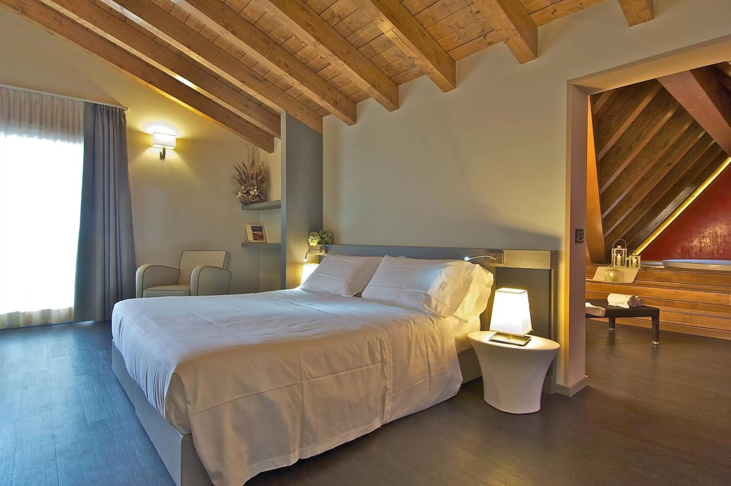 Bed in Harmony Suite Hotel