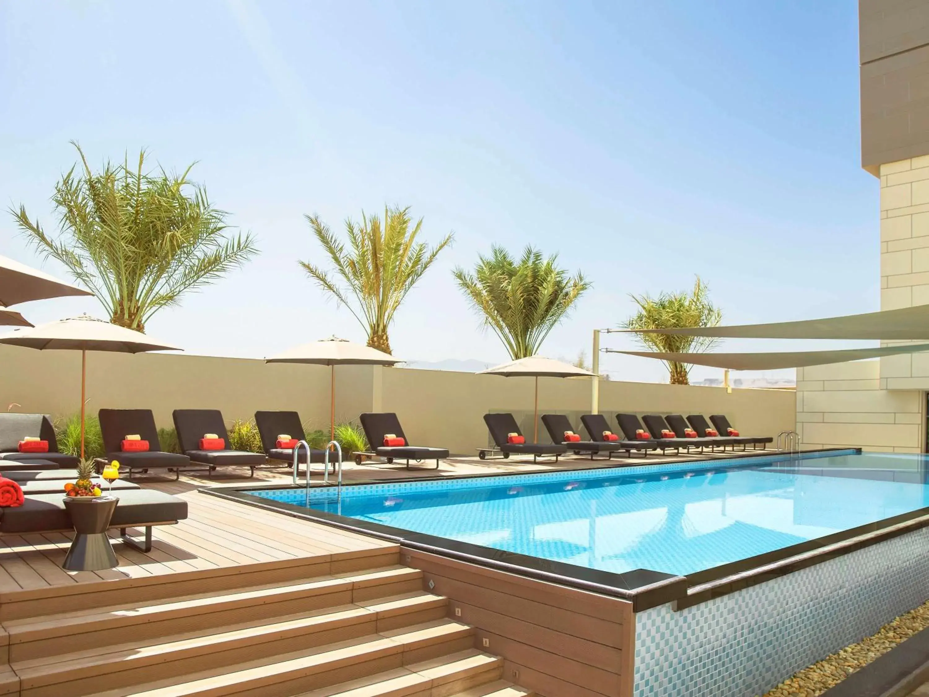 Property building, Swimming Pool in Novotel Muscat Airport