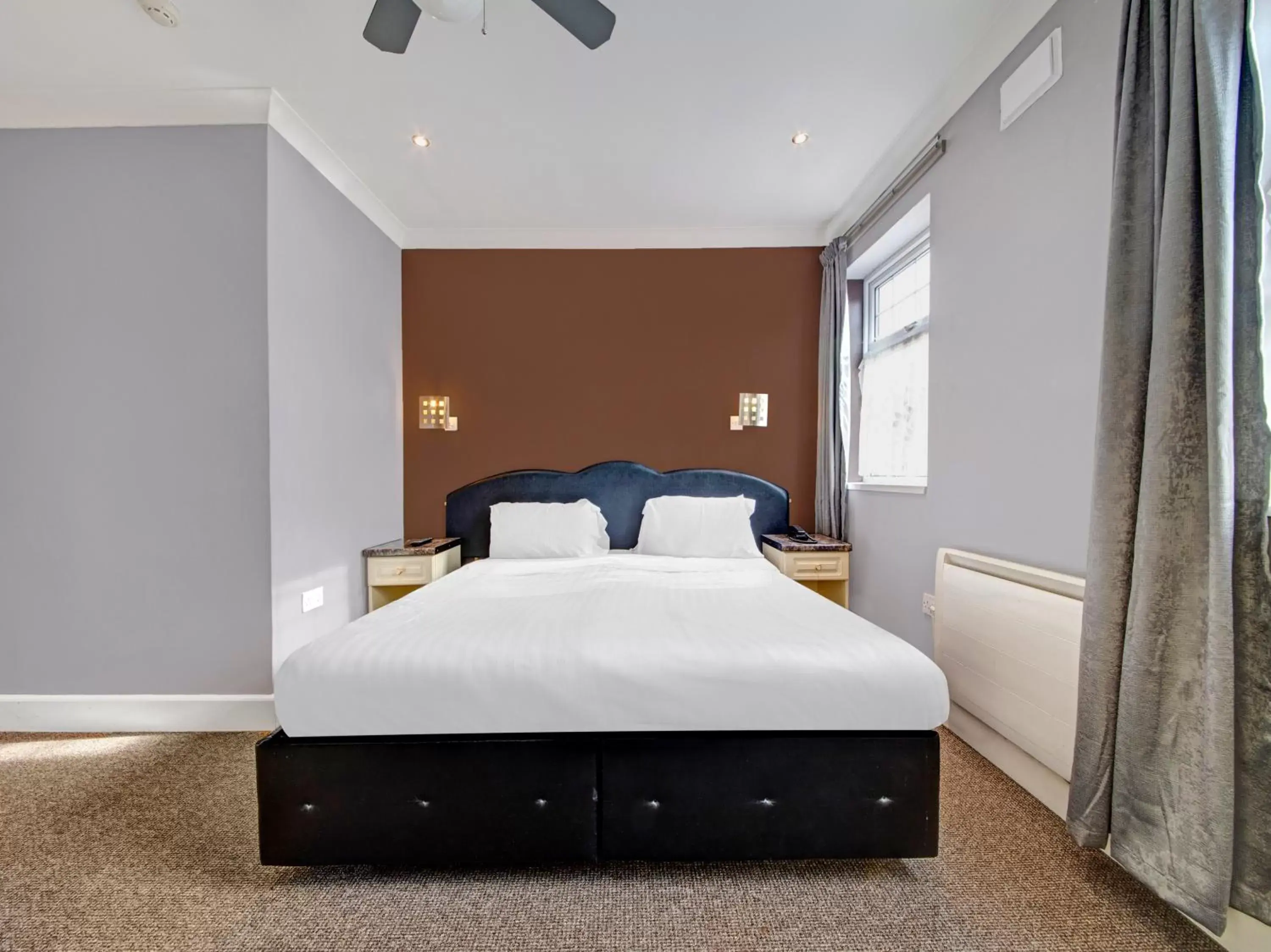 Bedroom, Bed in OYO Bostons Manor Hotel