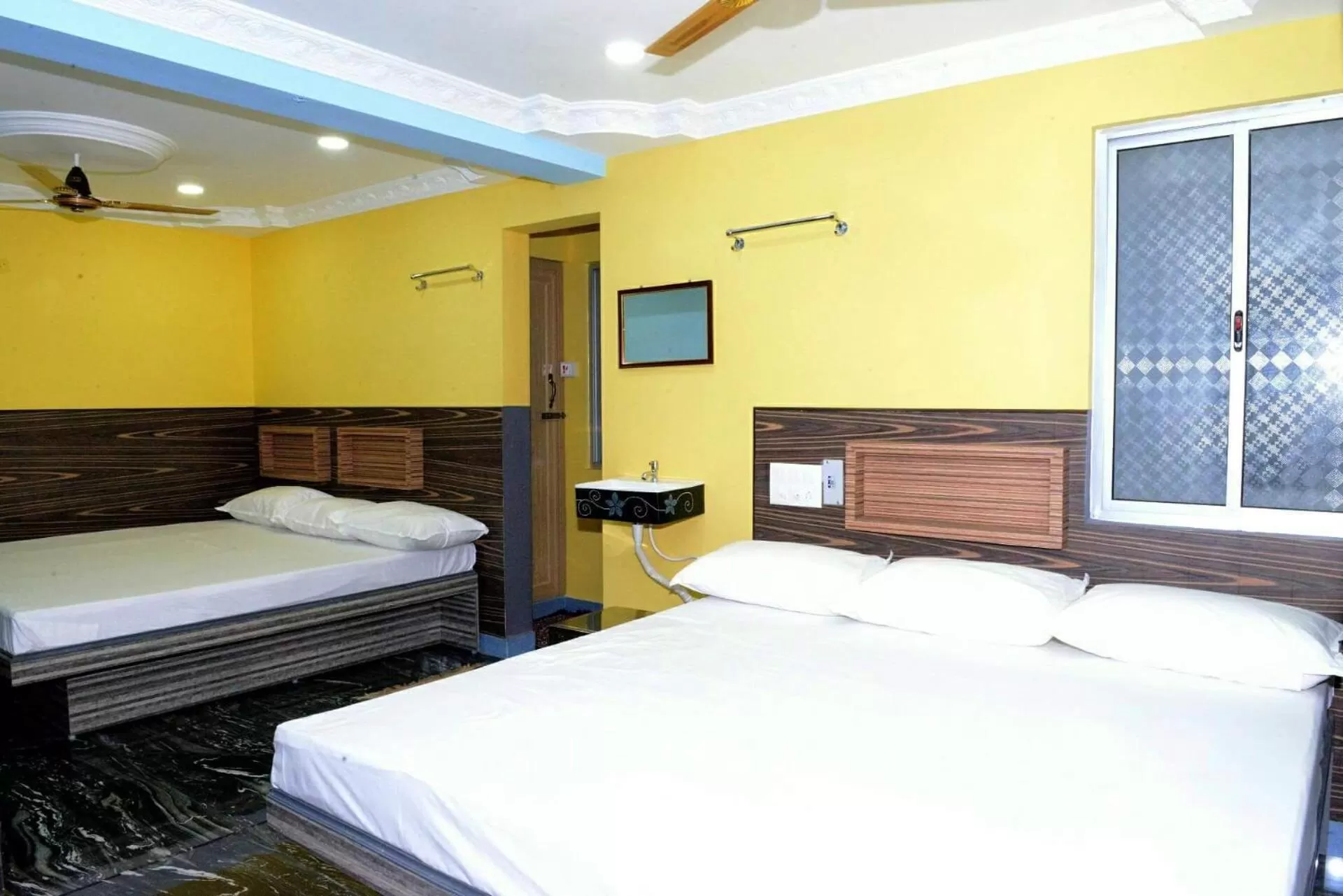 Bed in Vasanth Villa