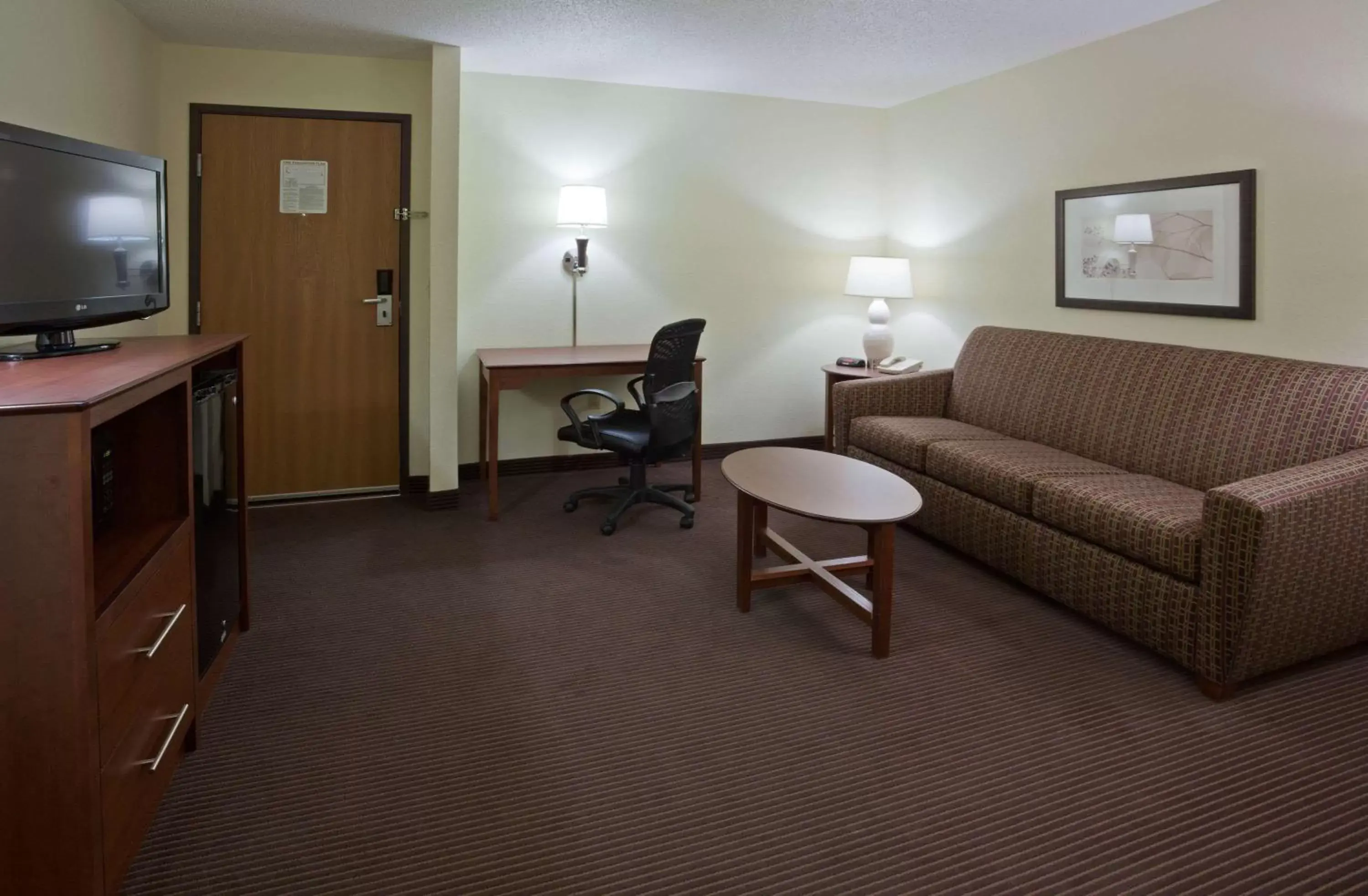 Living room, Seating Area in AmericInn by Wyndham Bismarck