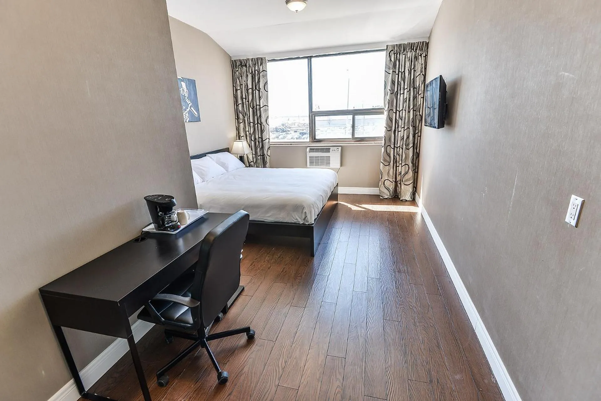 Photo of the whole room, Bed in NU Hotel Toronto Airport