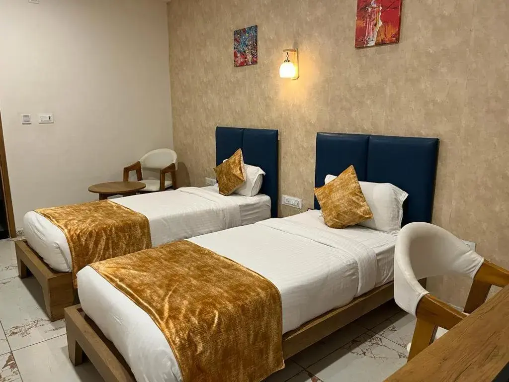 Bed in Click Hotel Tulsi