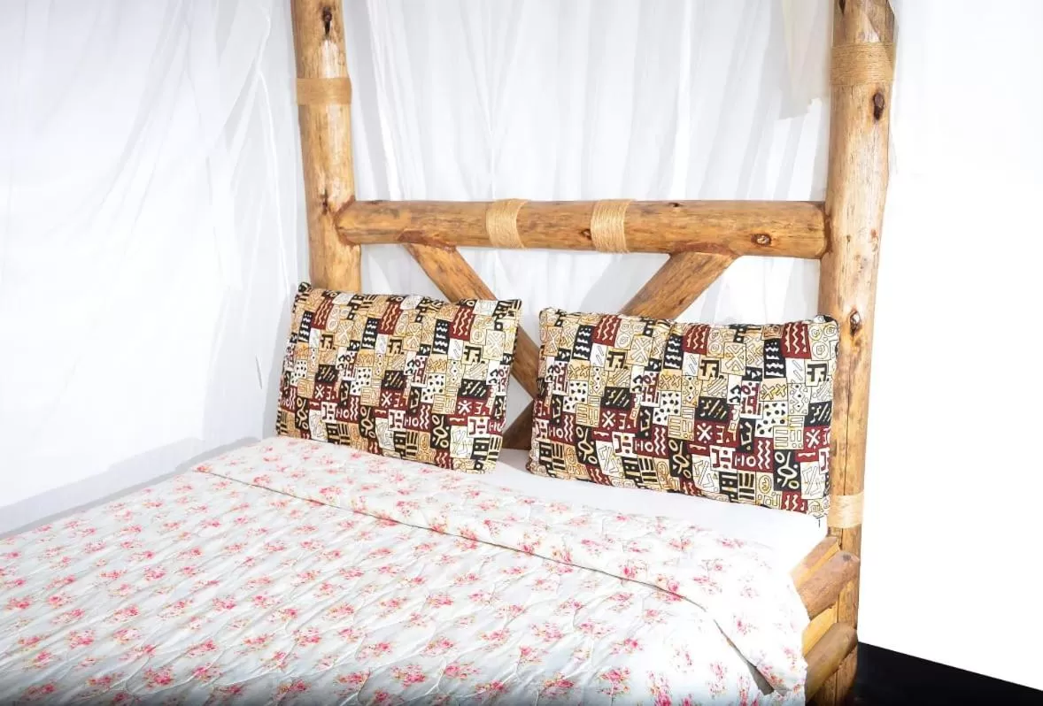 Bed in Charming Eco-Homestay near Kilimanjaro International Airport