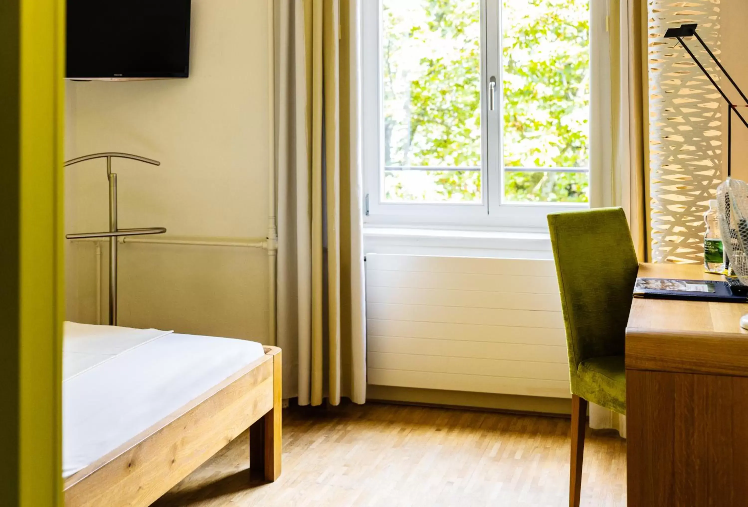Seating area, Bed in ODELYA Hotel & Naturgarten Basel City