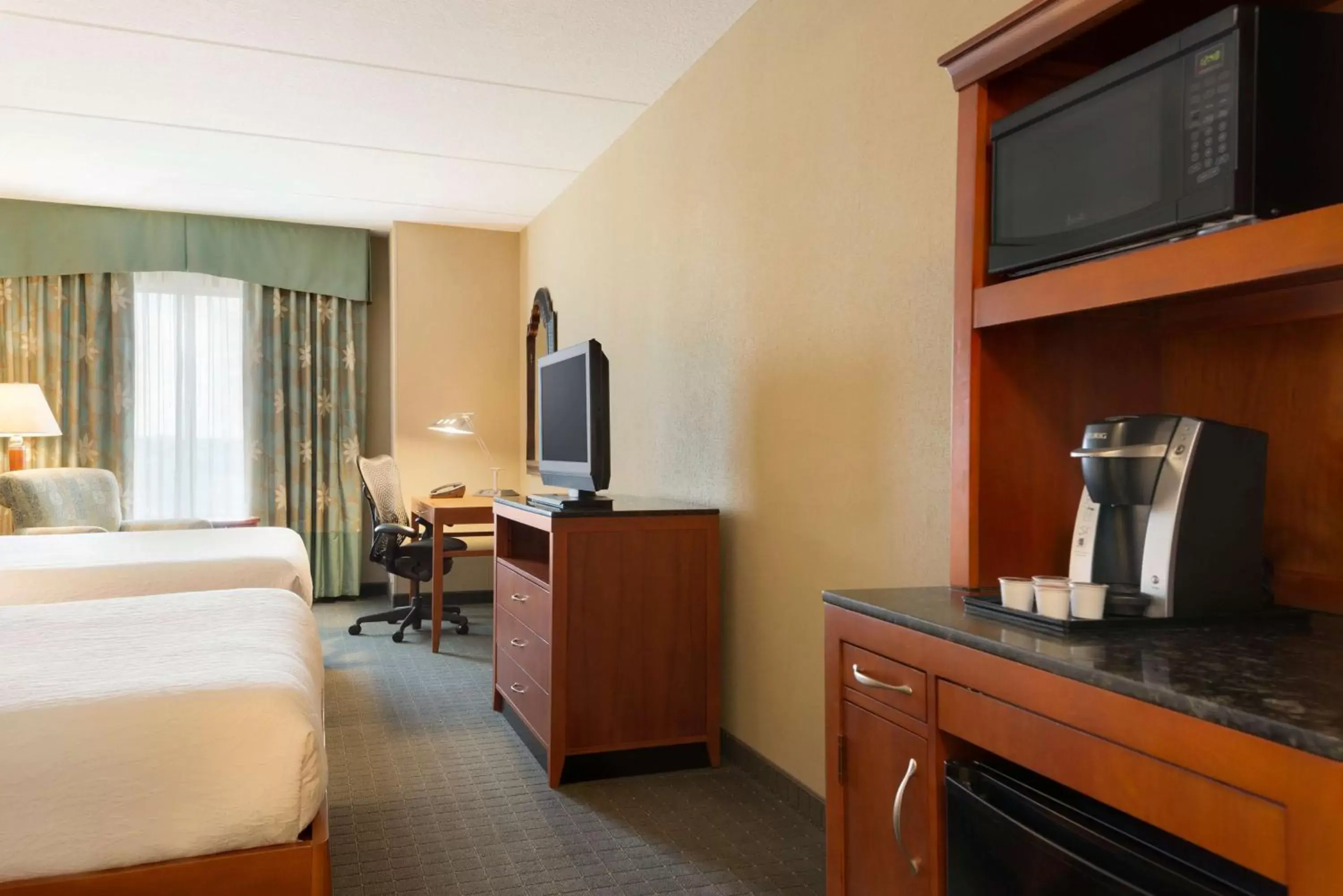 Bed, TV/Entertainment Center in Hilton Garden Inn Palm Coast Town Center